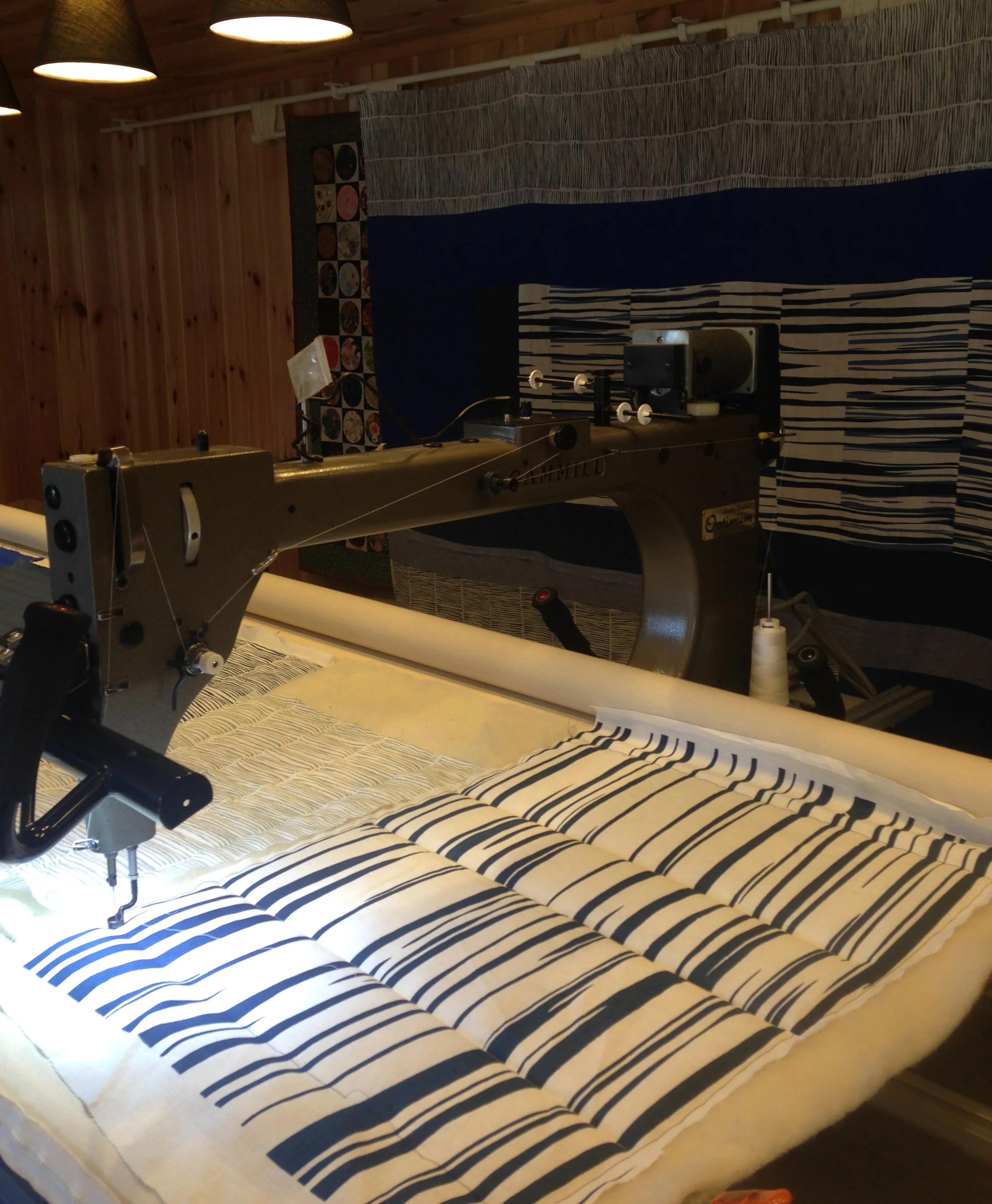 Designing the stitch pattern for the top of the quilt took a whole day of experimentation and sampling but it was certainly worth it! Here is 'Matilda' the long arm quilting machine in action.