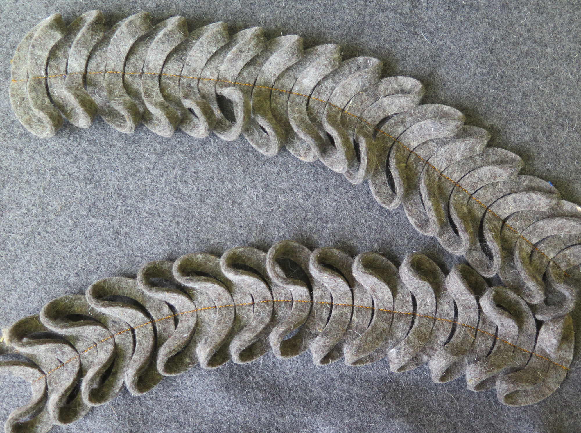 The final chair is made from 100% wool felt with felt washers stitched on to create a beautiful undulating texture.