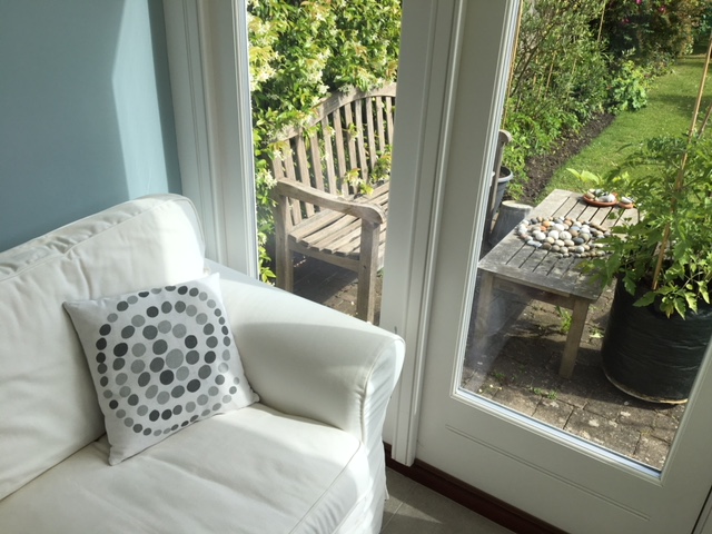 In complete contrast to the first design was this beautifully subtle print which was based on a stone sculpture that featured 76 perfectly round pebbles. The repetitive cutting of the circles pushed him to the limit but seeing this photo of the cushion in a beautiful garden room I think it was definitely worth it!