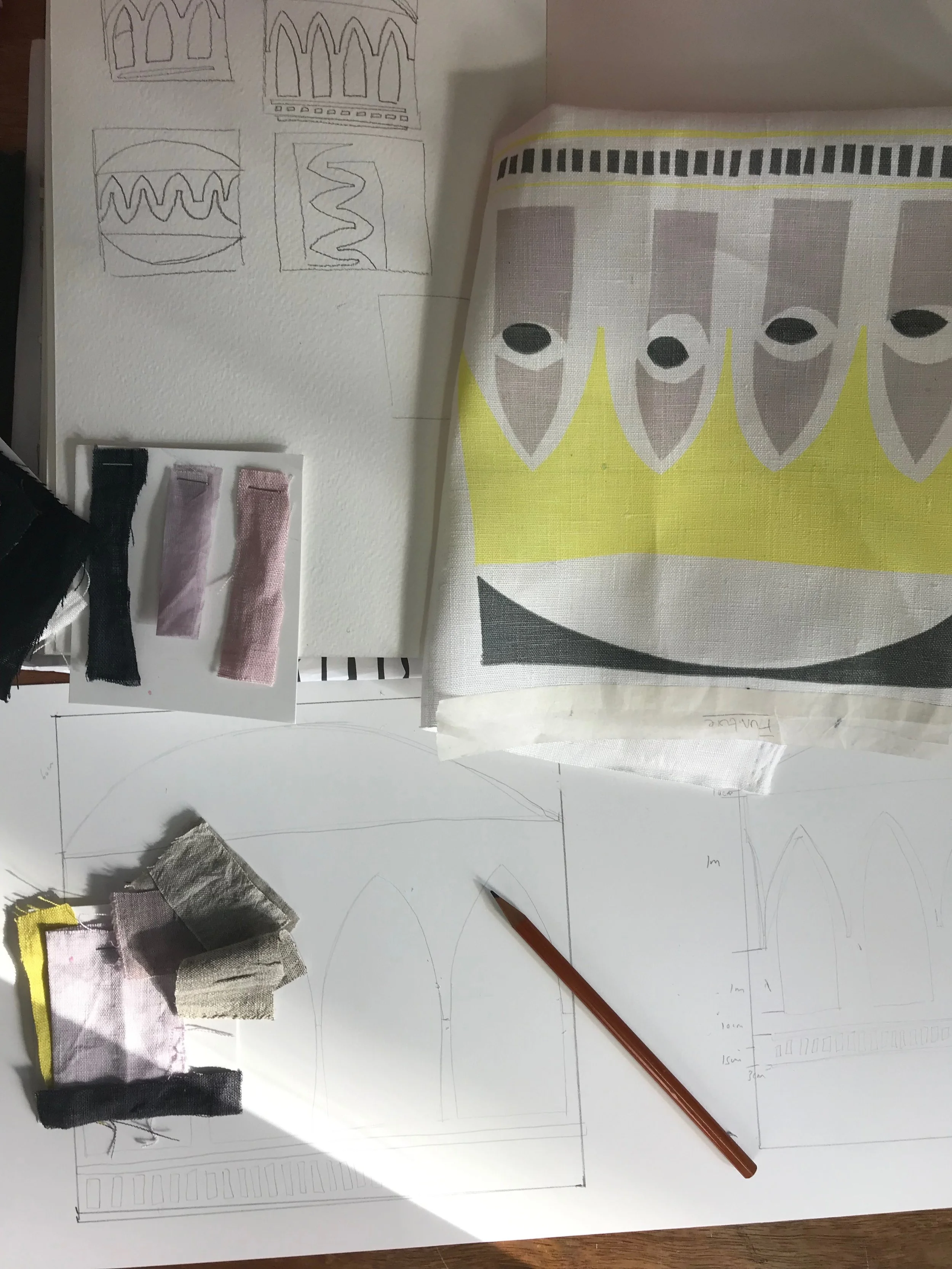 The beginning of the design process, a screen printed sample, a scale drawing and a few fabric swatches.