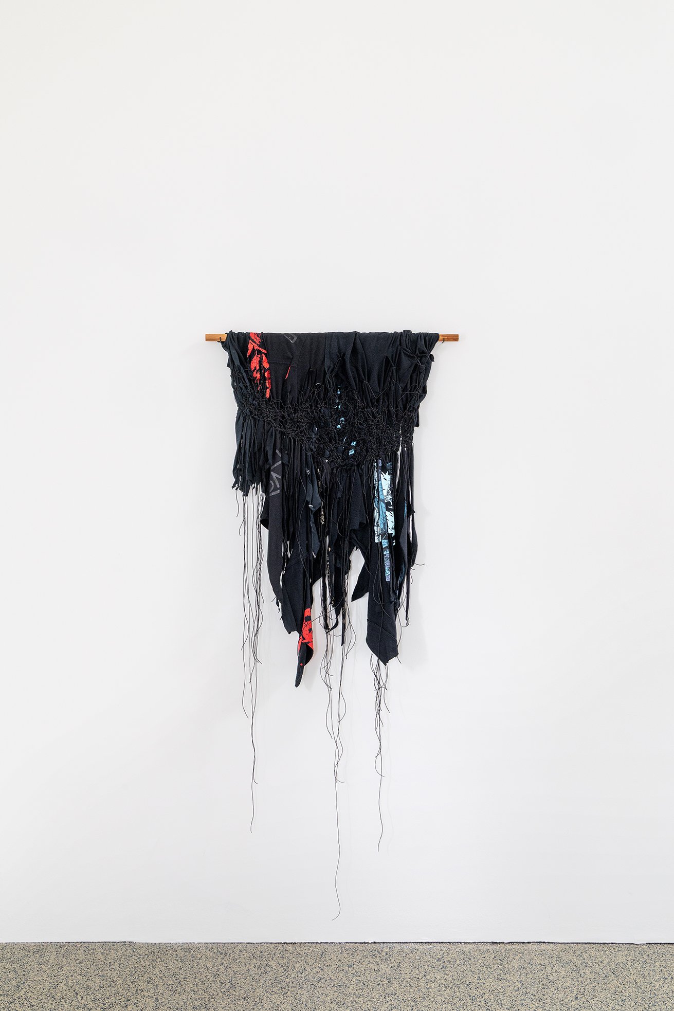 REMAKE, 2025  Selected band t-shirts (2007-2014), waxed cord, metal rod