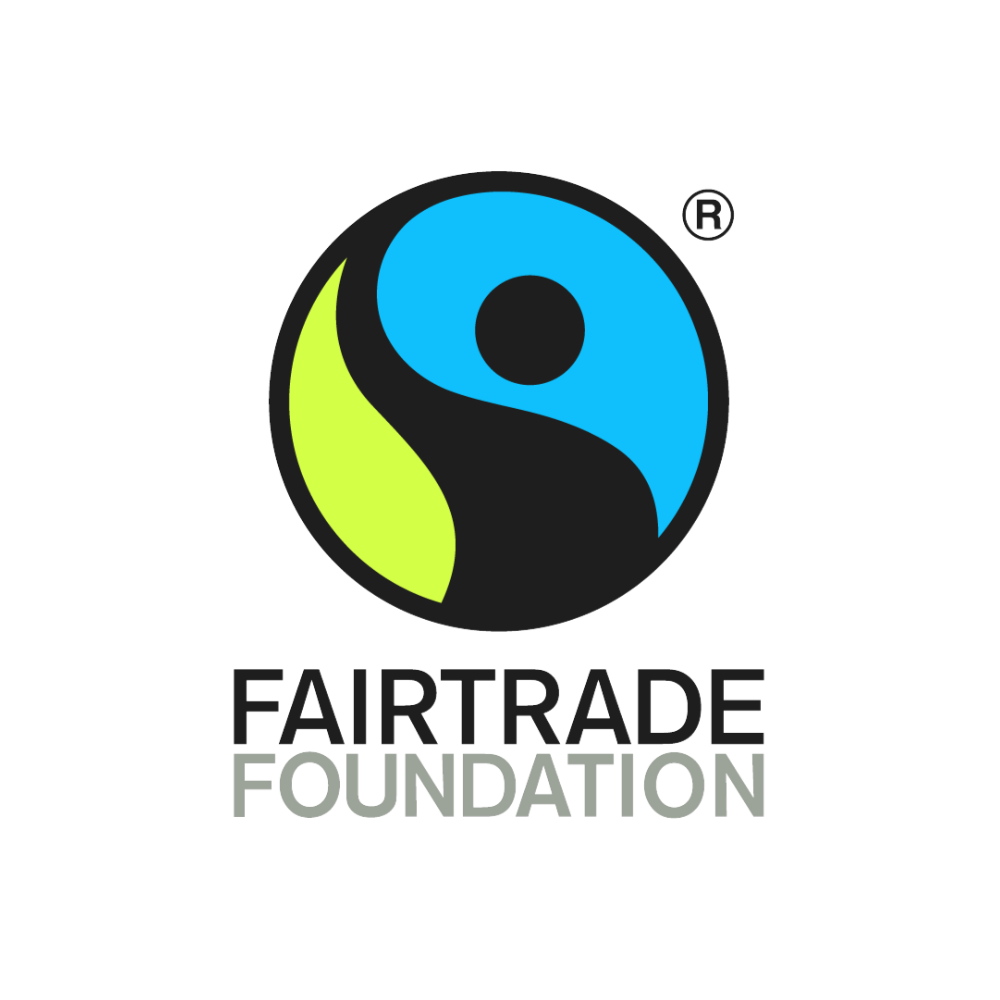 An image of Fairtrade Foundation's logo, which shows an image of a person raising their hand in a blue-green circle.