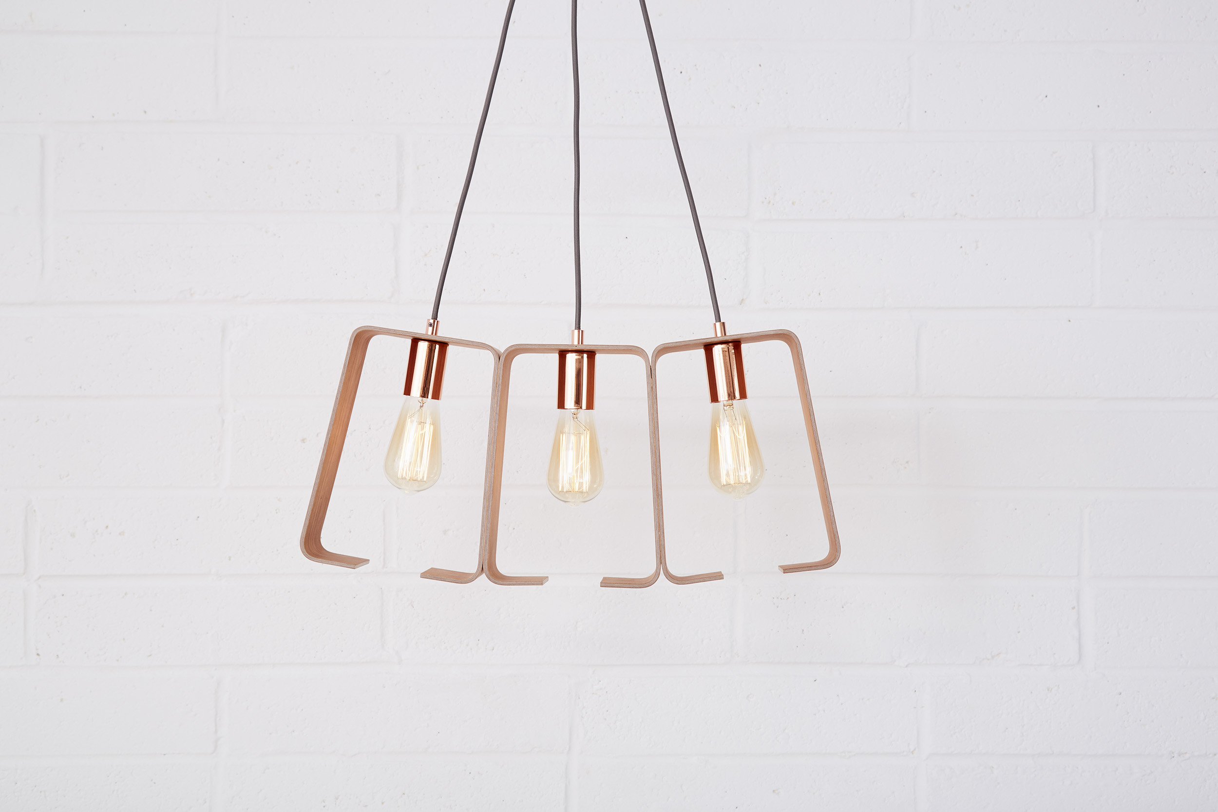 Fab chandelier in copper fittings and cherry veneer by Lozi