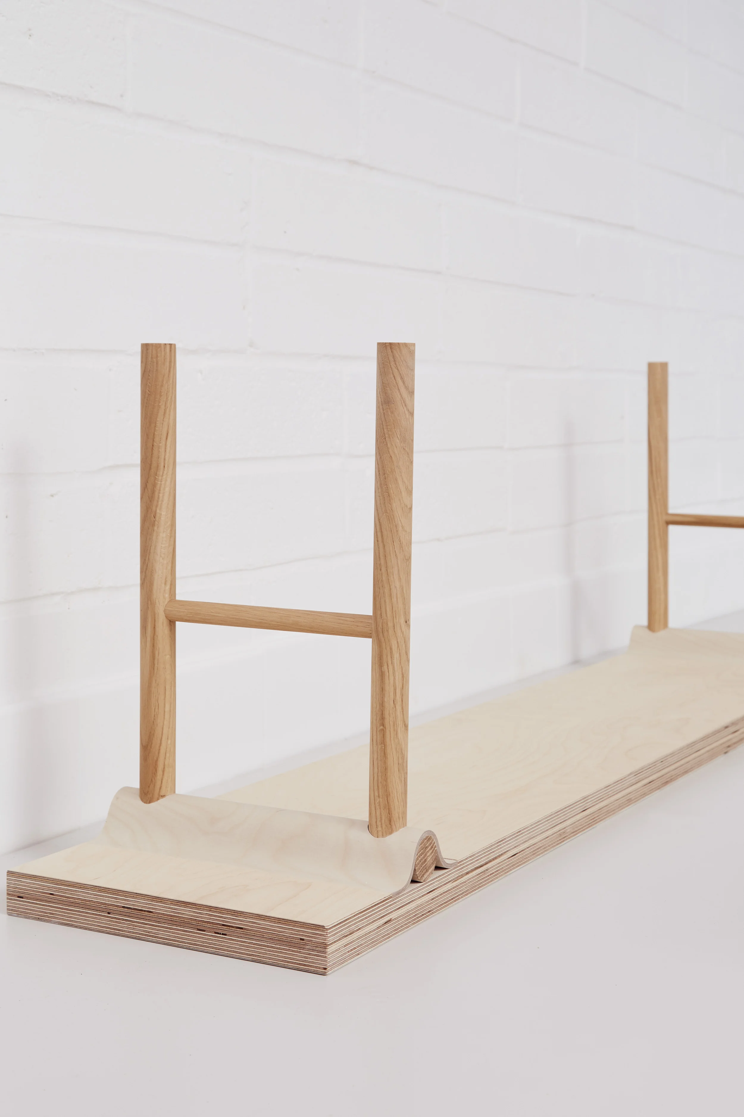Detail of curved joint on Lozi's plywood and oak bench.