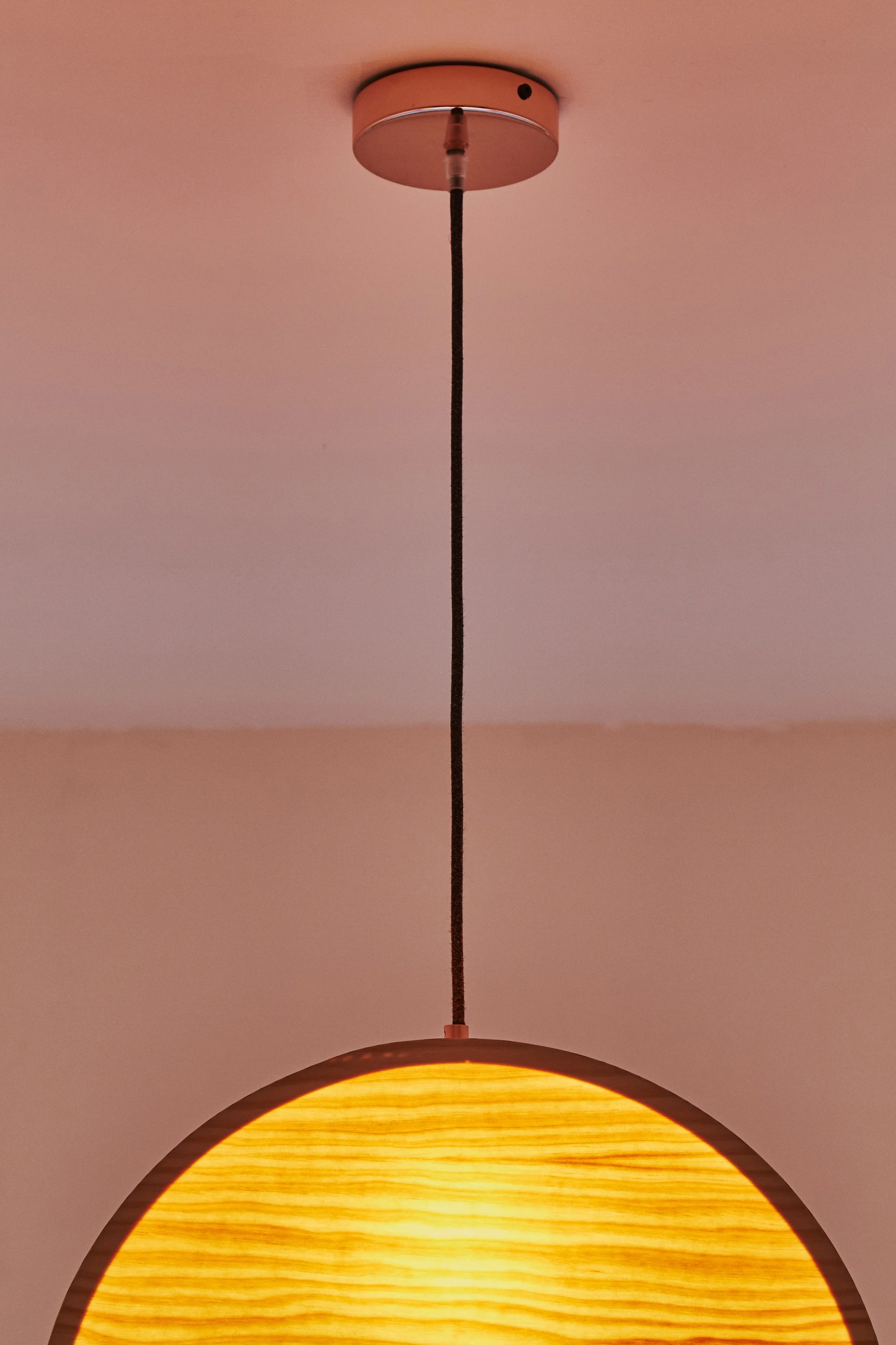 Ceiling ring and detail of the Sunset Lamp made from plywood by Lozi