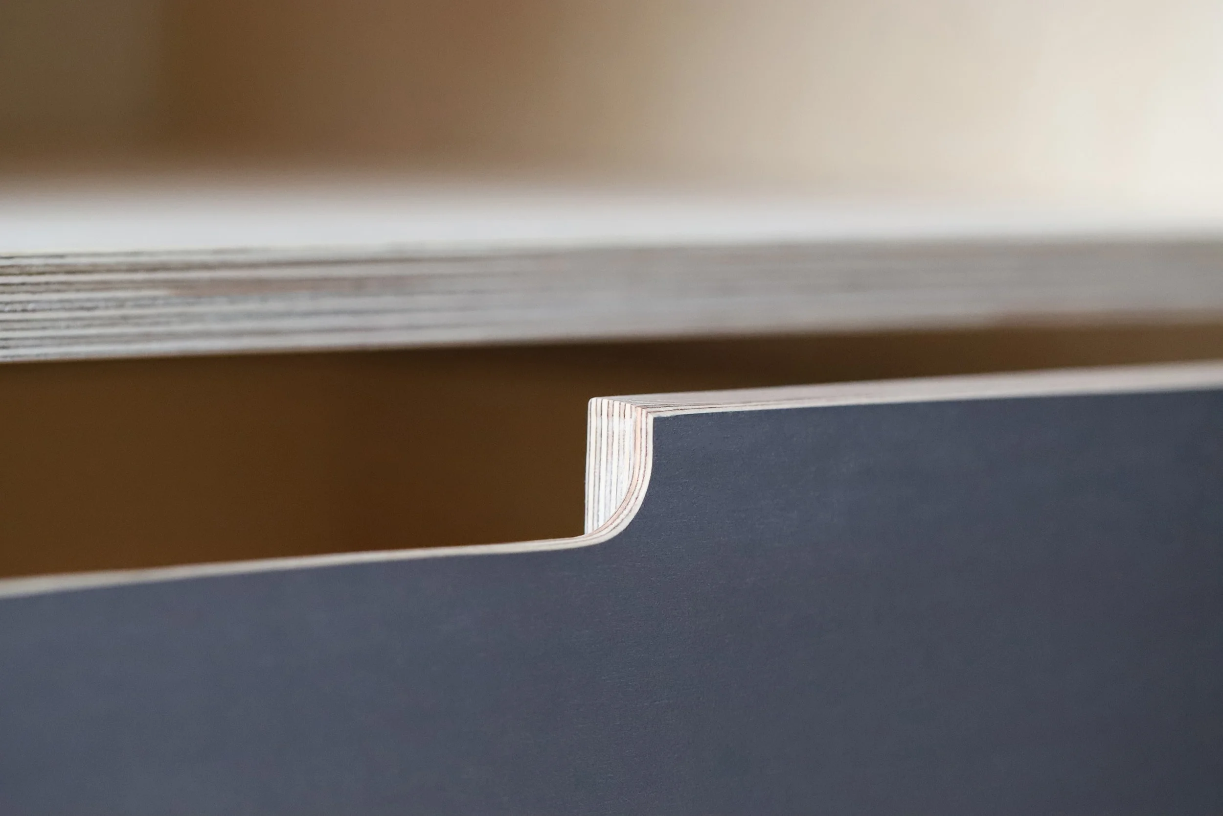 The smooth handles on each drawer.