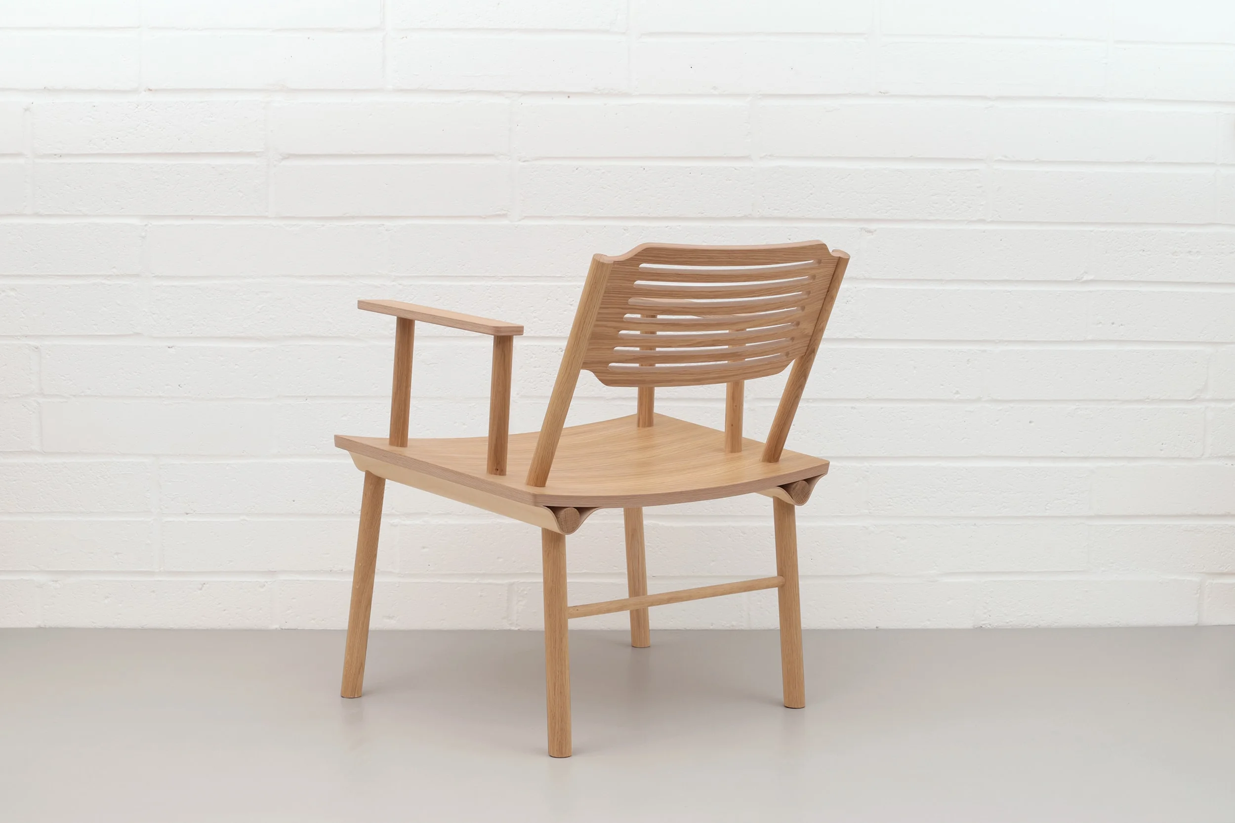 Back view of Lozi's lounge armchair, the Rio Chair, made from curved plywood