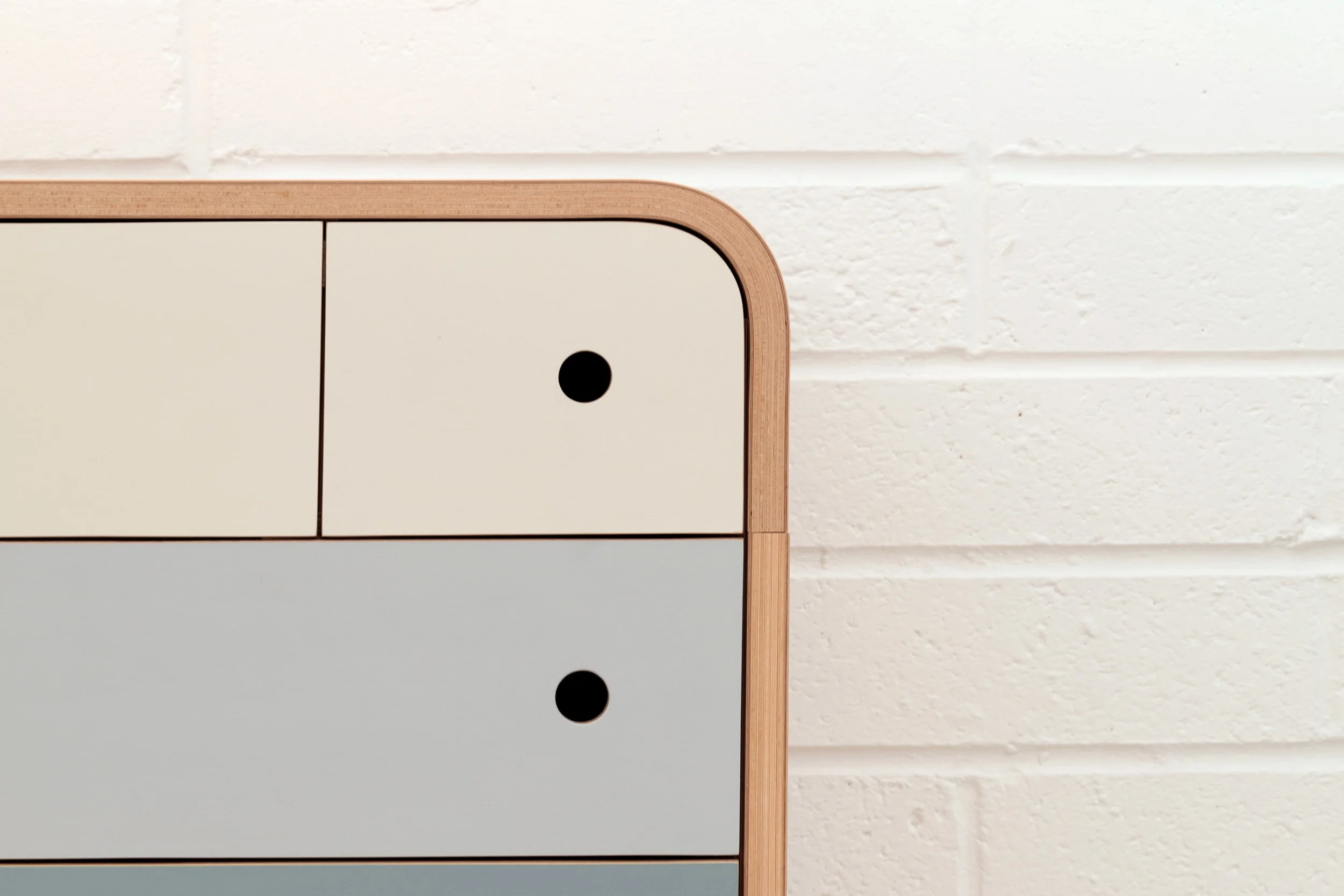 A close up of the top small drawer from Lozi's plywood chest of drawers.