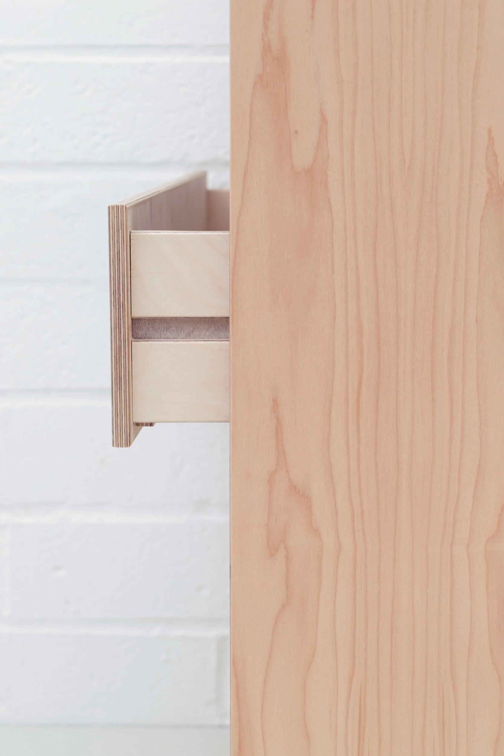 The side view of a drawer from the plywood chest of drawers by Lozi.