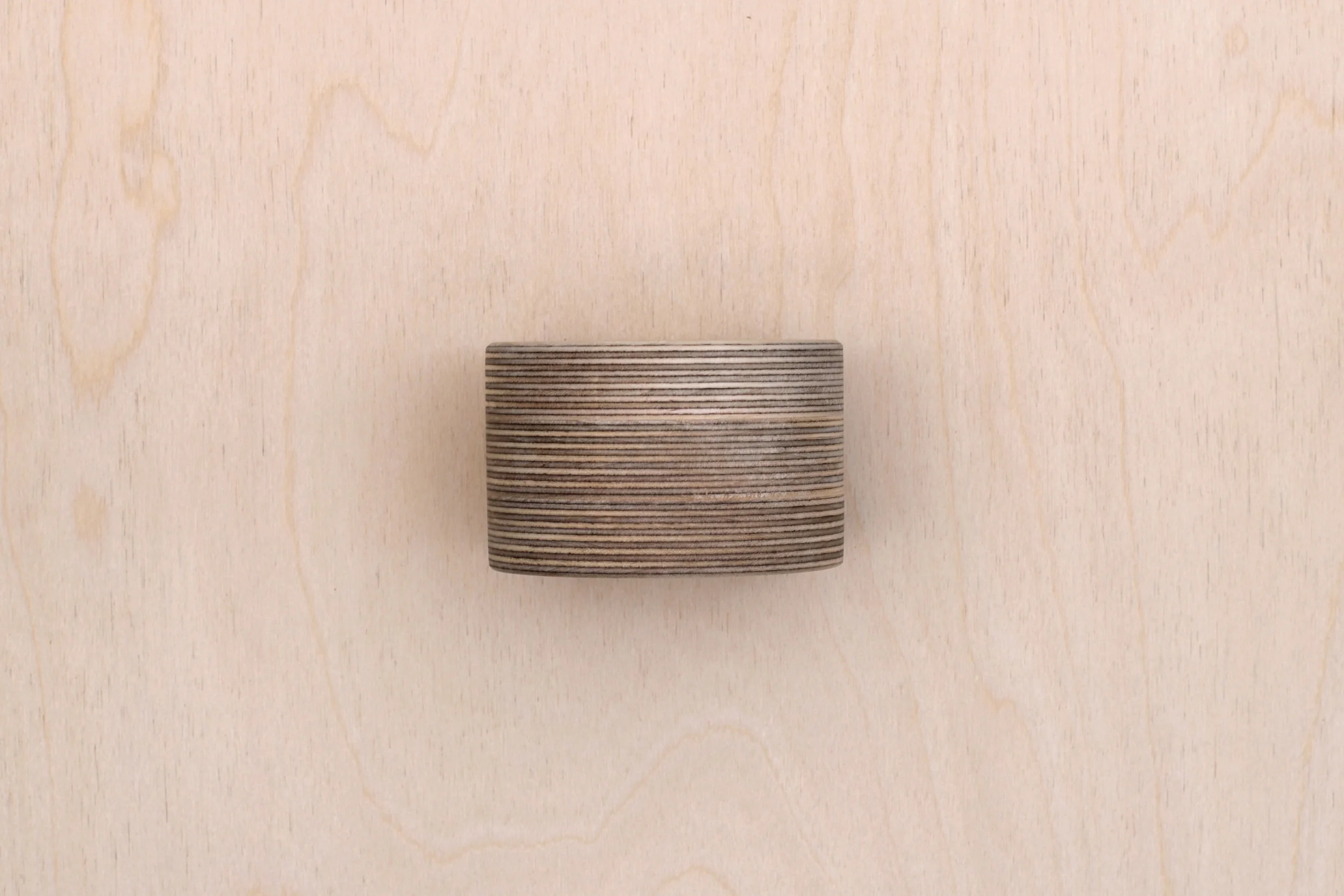 The side of a single mini plant pot with plants from Lozi's £9.99 Collection made from waste materials