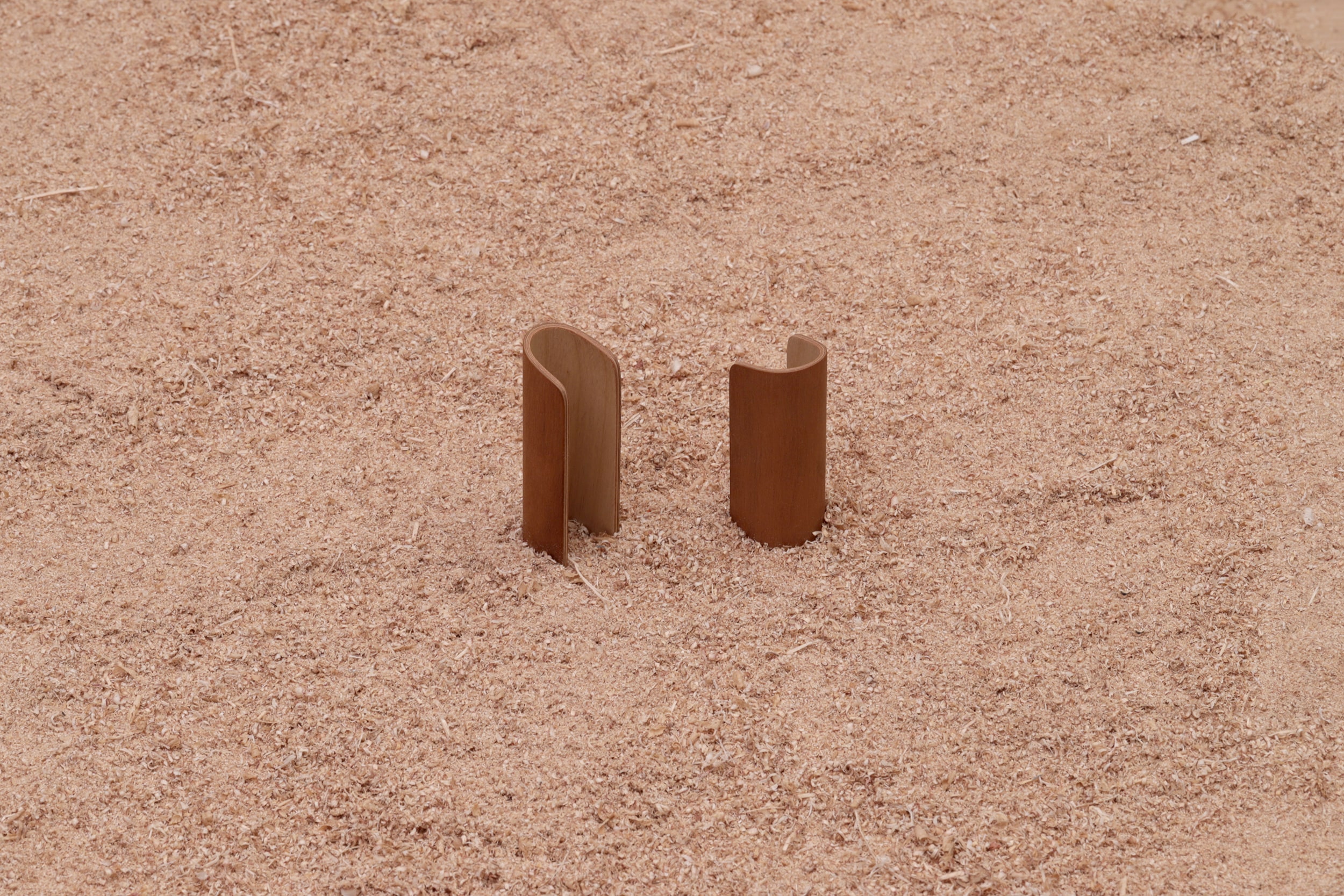 A pair of curved plywood easy bag handles from Lozi's £9.99 collection made from waste materials