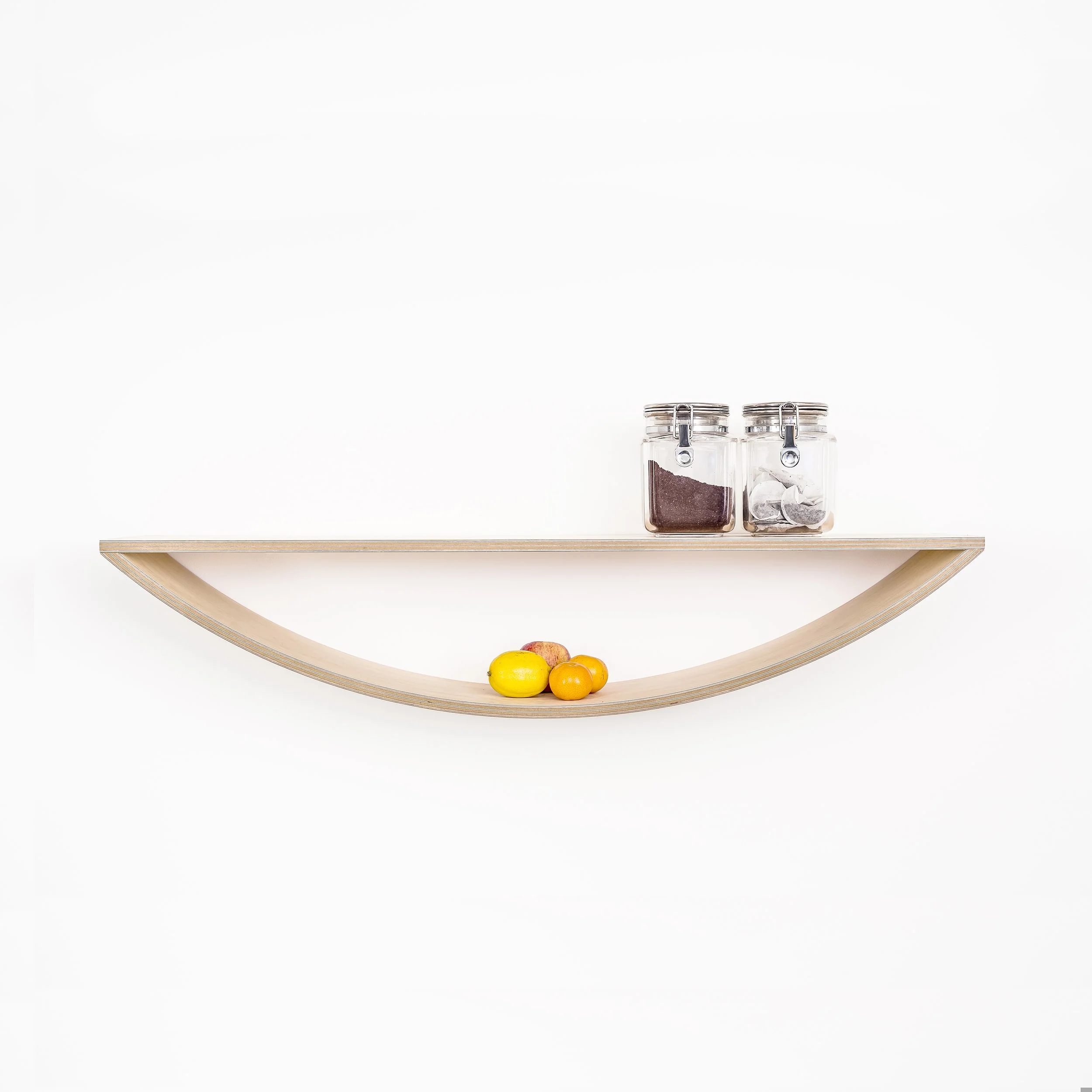 A large curved plywood smile shelf by Lozi