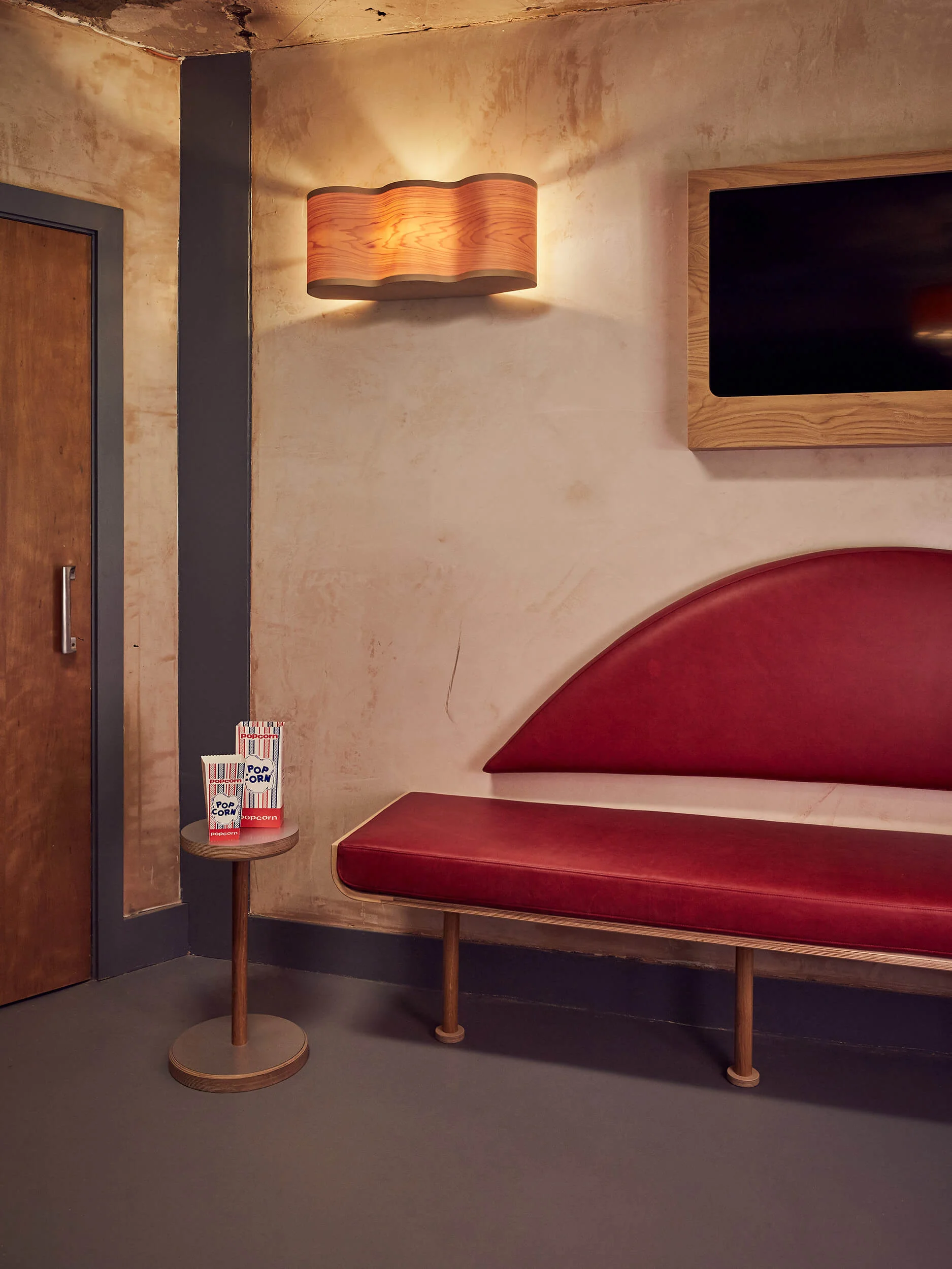 The up-cycled vintage seat turned into a backrest, with curved lights.