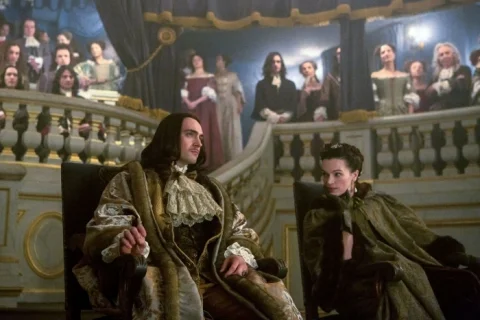 King Louis XIV (George Blagden) attends a play with his controlling mistress, Madame de Montespan (Anna Brewster).