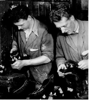 Jeff (left) and Joe Foster finishing football boots in 1958