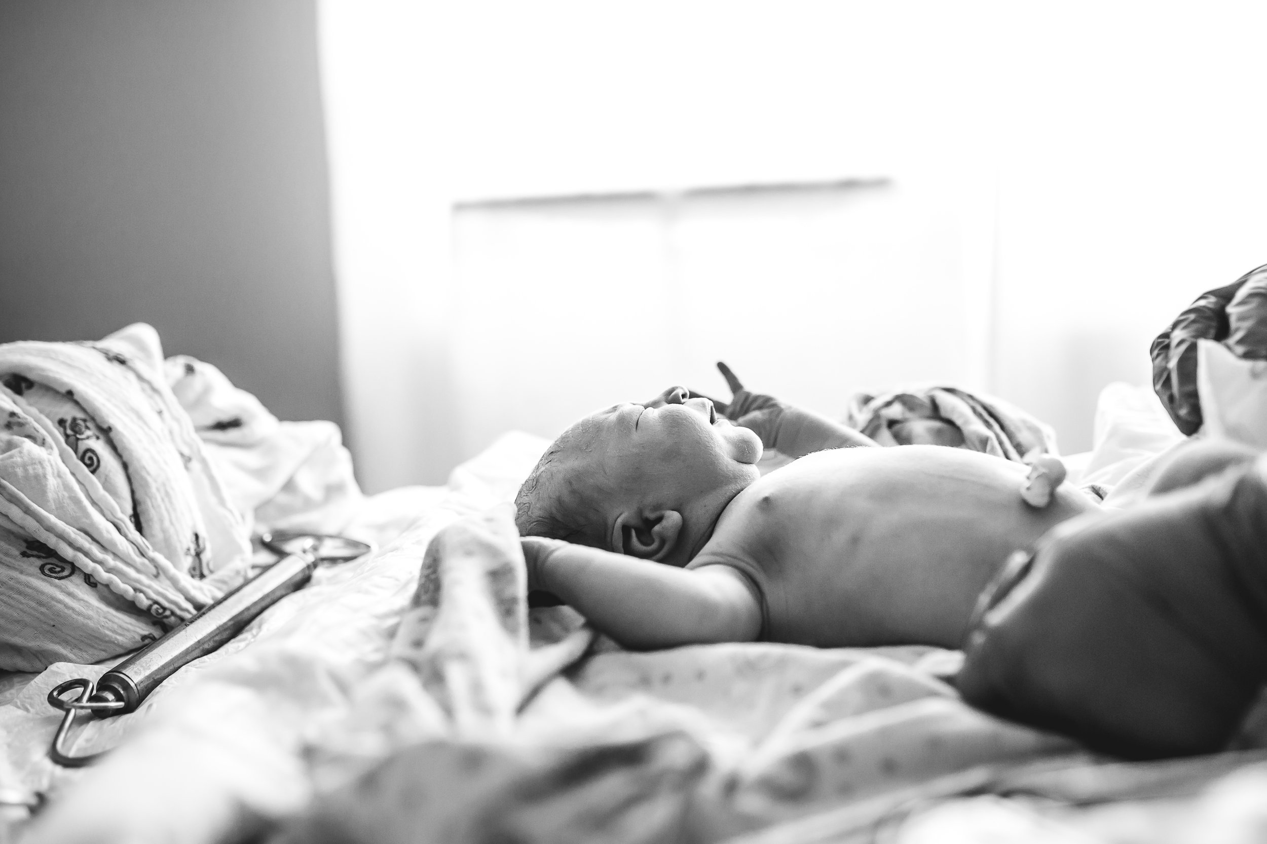 newborn baby born at home checked by midwife