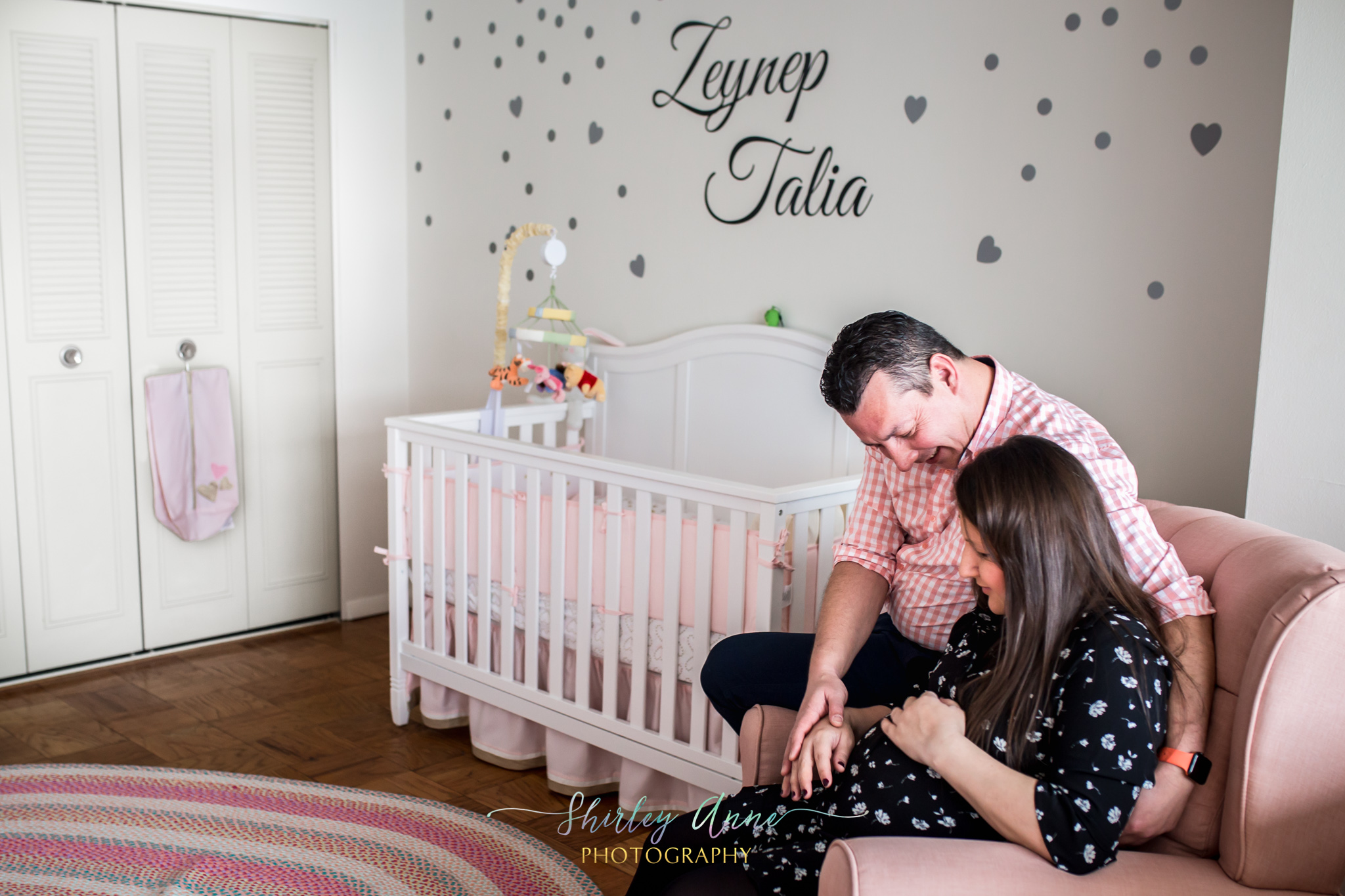 home session with pregnant mom and father in nursery room