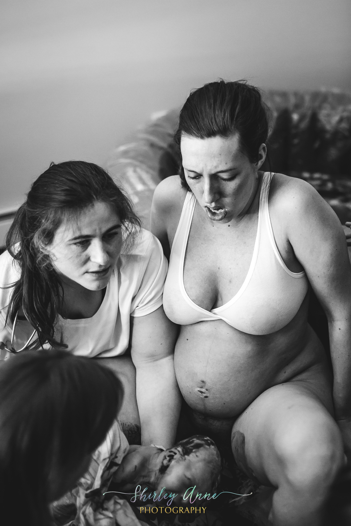 mom sees baby for the first time during home birth