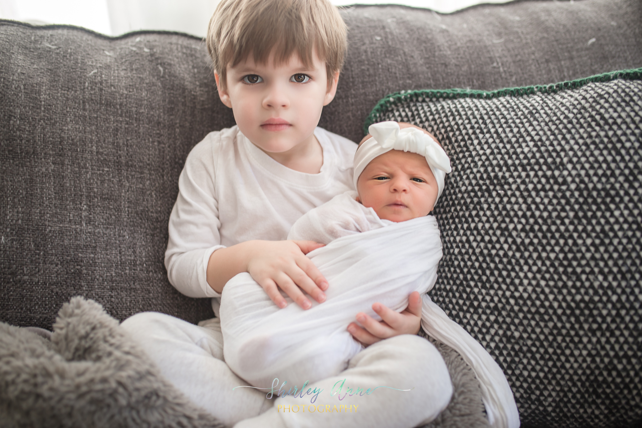 toddler boy with newborn sibling photo session