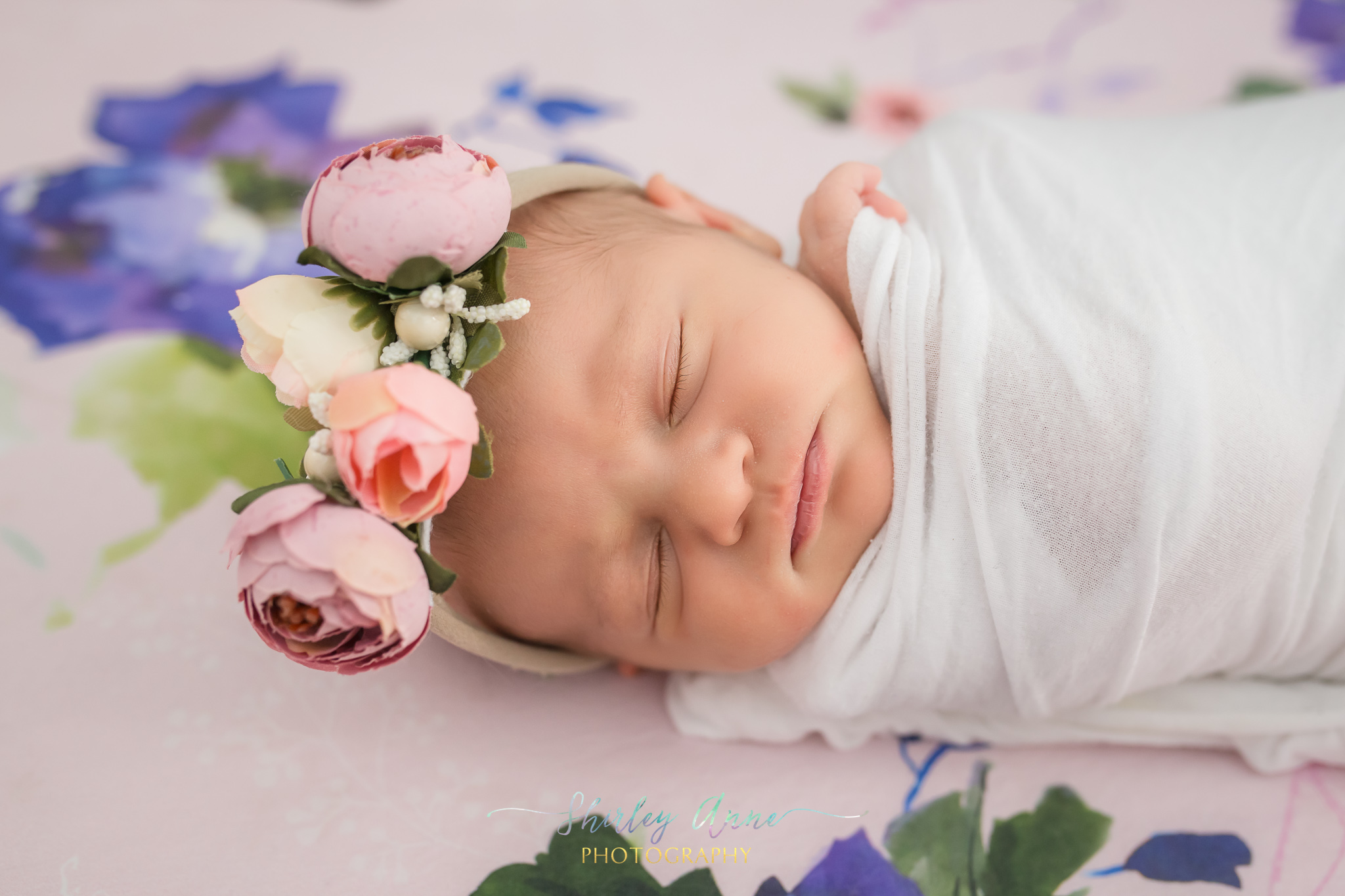 newborn baby with flower crown newborn session