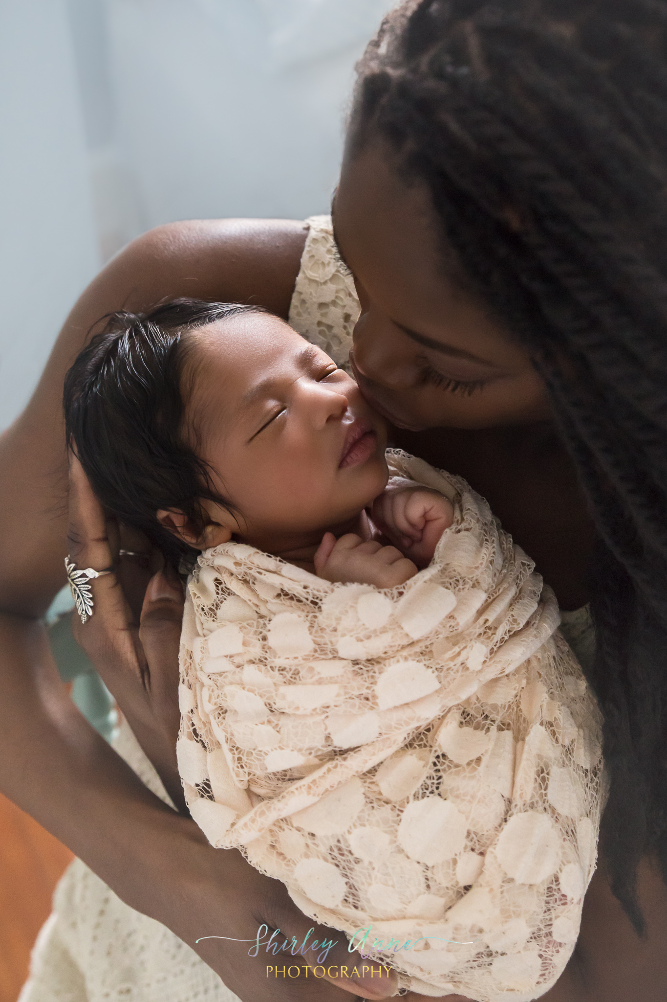 beautiful african american mom with baby girl photography session
