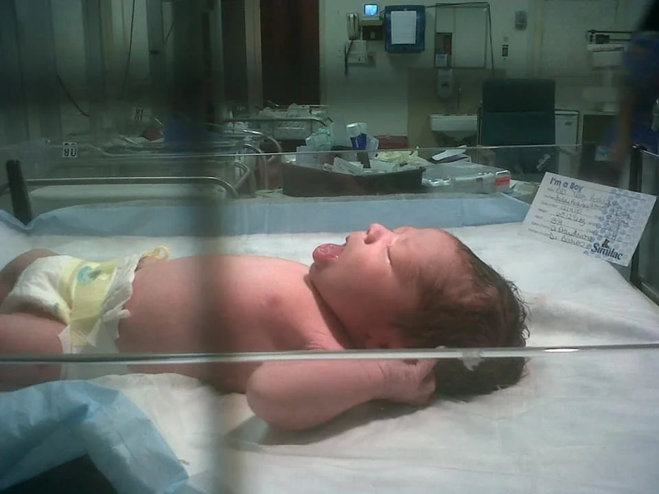 My sister was able to take this picture of him while he was in the nursery, they didn't bring him to me for 4 hours :(. 