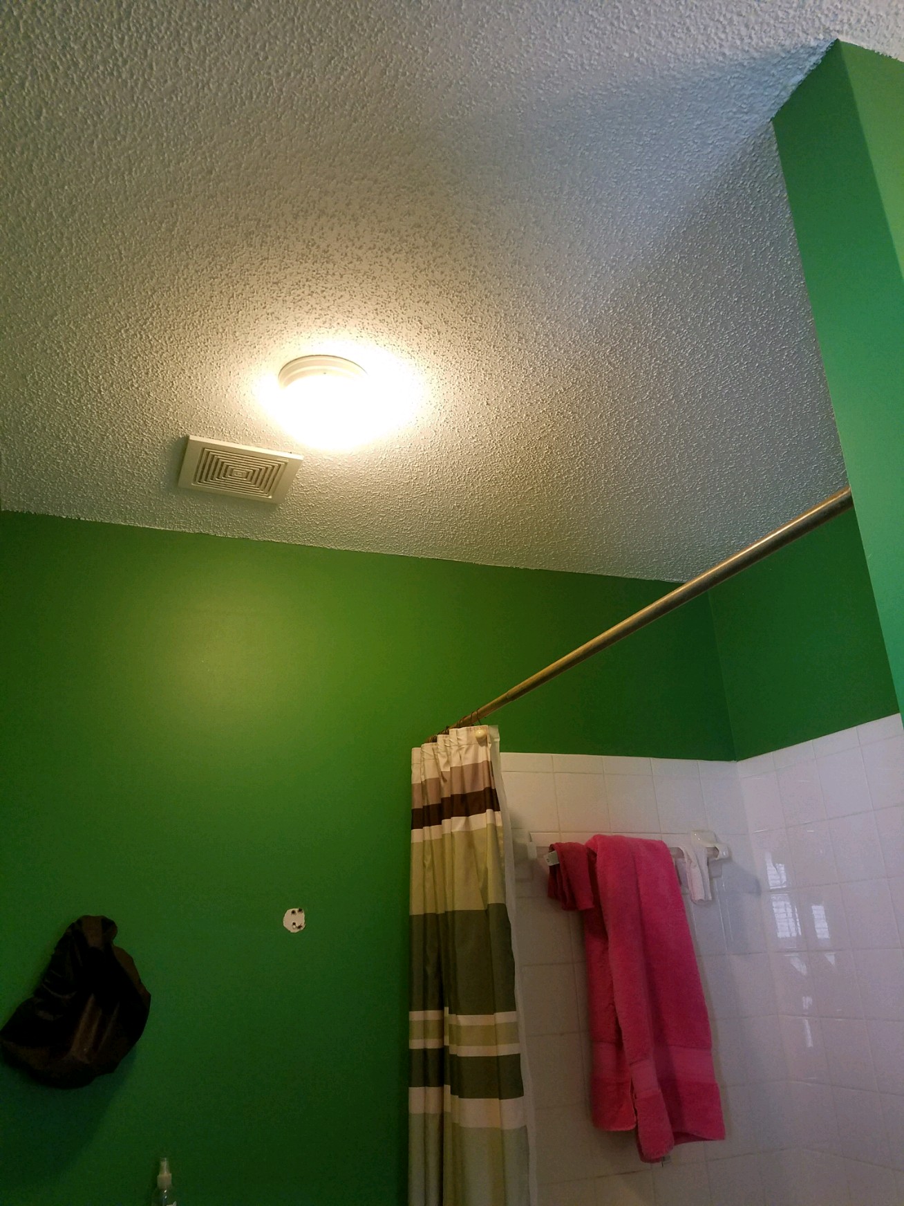 Popcorn ceiling dates this master bath.