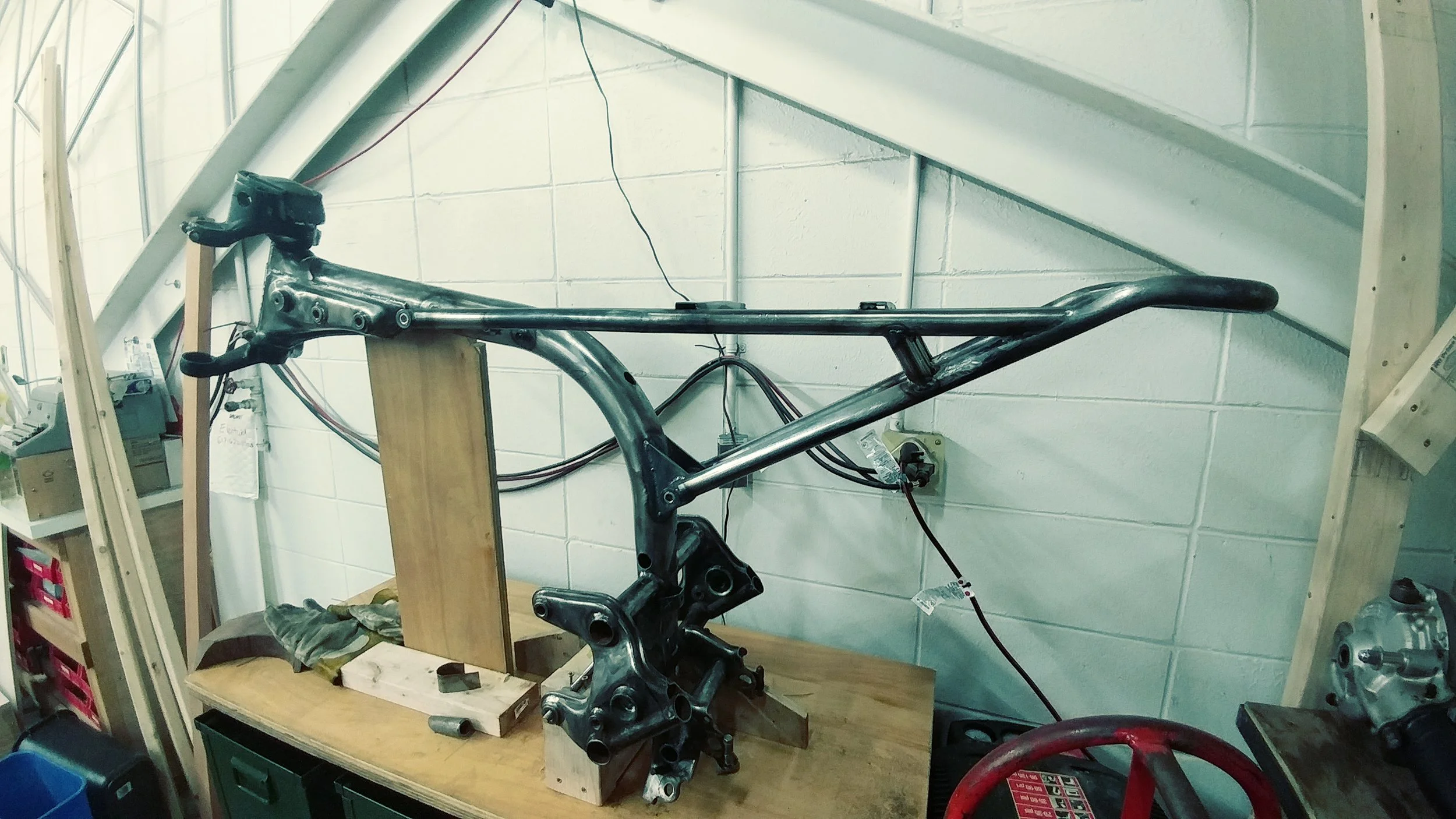 New custom subframe bolted up to the remaining factory frame tube.