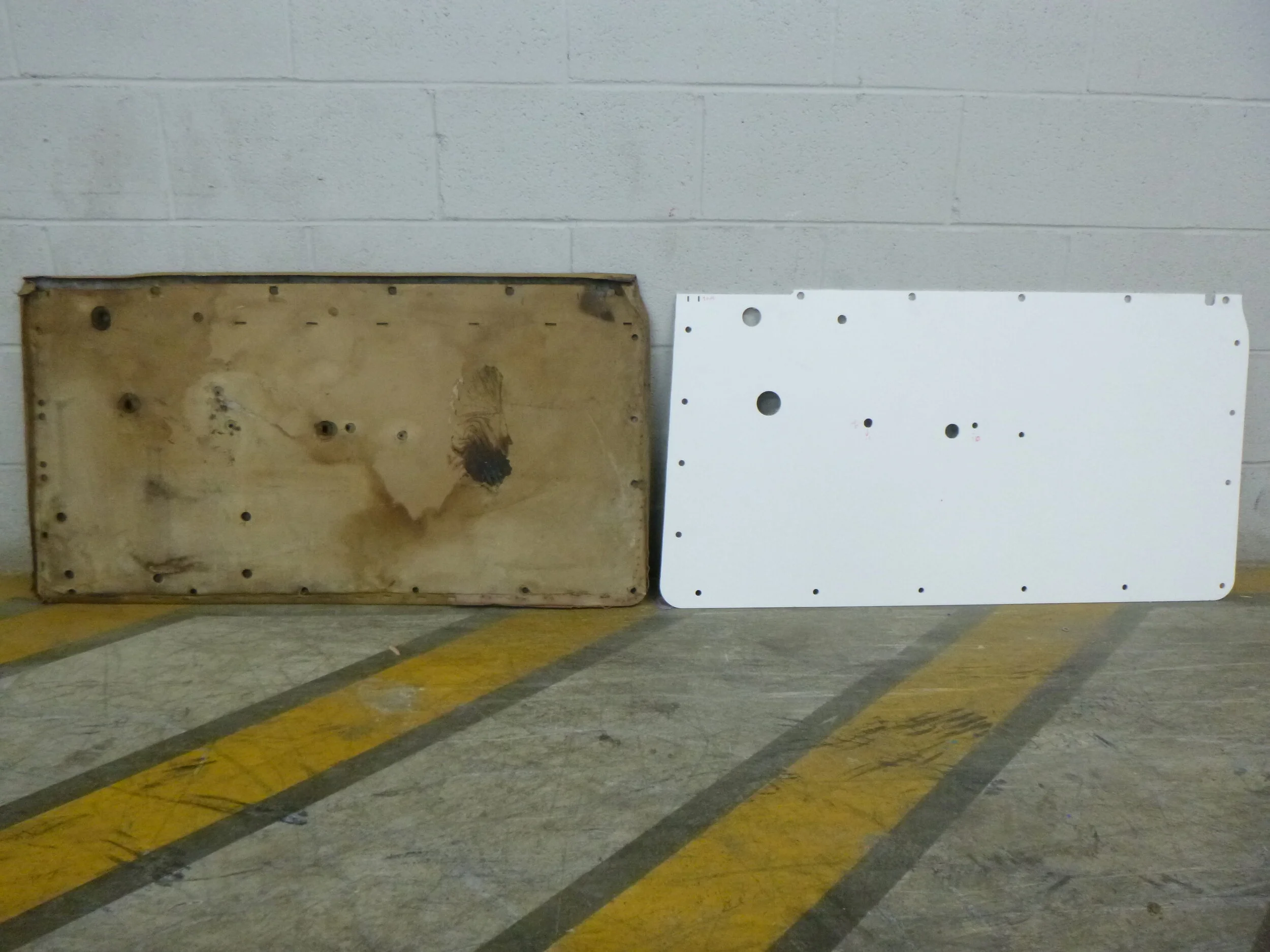  The old door card and the new panel, side by side.  The new panel was cut from 3mm expanded PVC foam sheet on CNC Router.  The hole locations from the students’ layout takeoff were pretty close, but some adjustments needed to be made, of course.  We