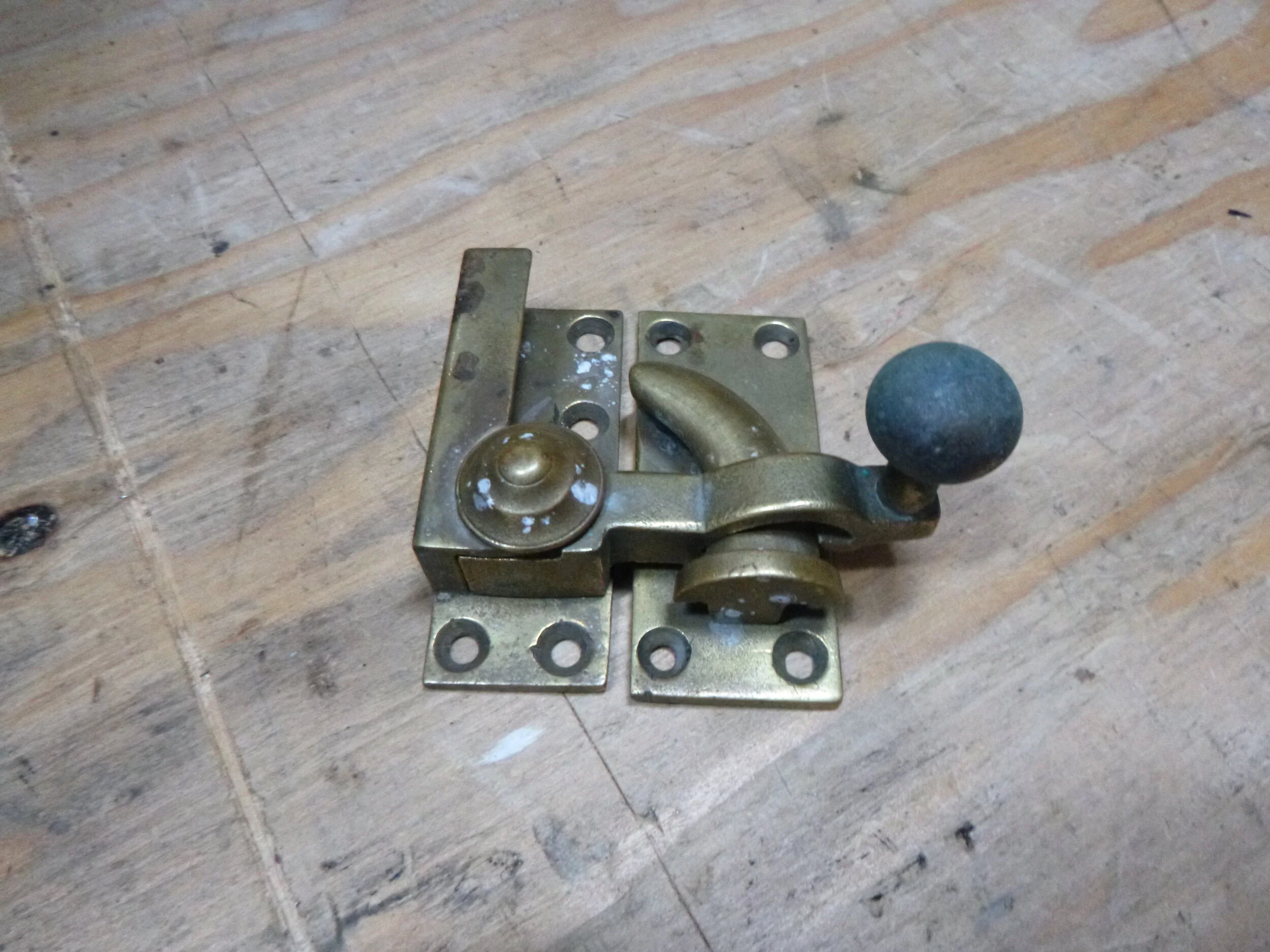  The client provided this cast brass latch.  It came from Romania via eBay.  It was possibly a window latch. 