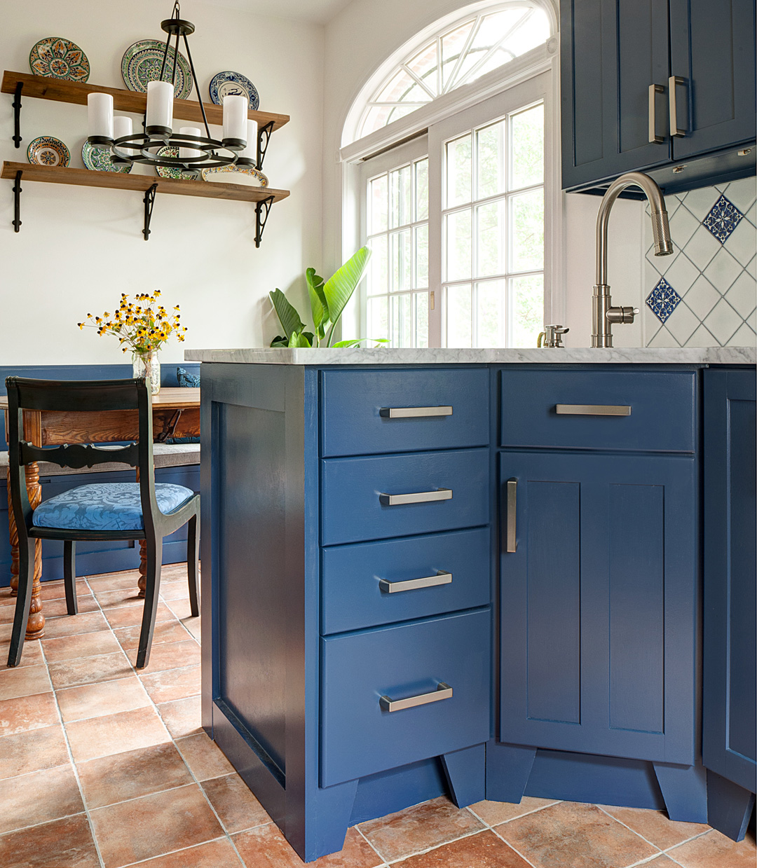 Large cabinet pulls are easy to grip. See more of this kitchen here .