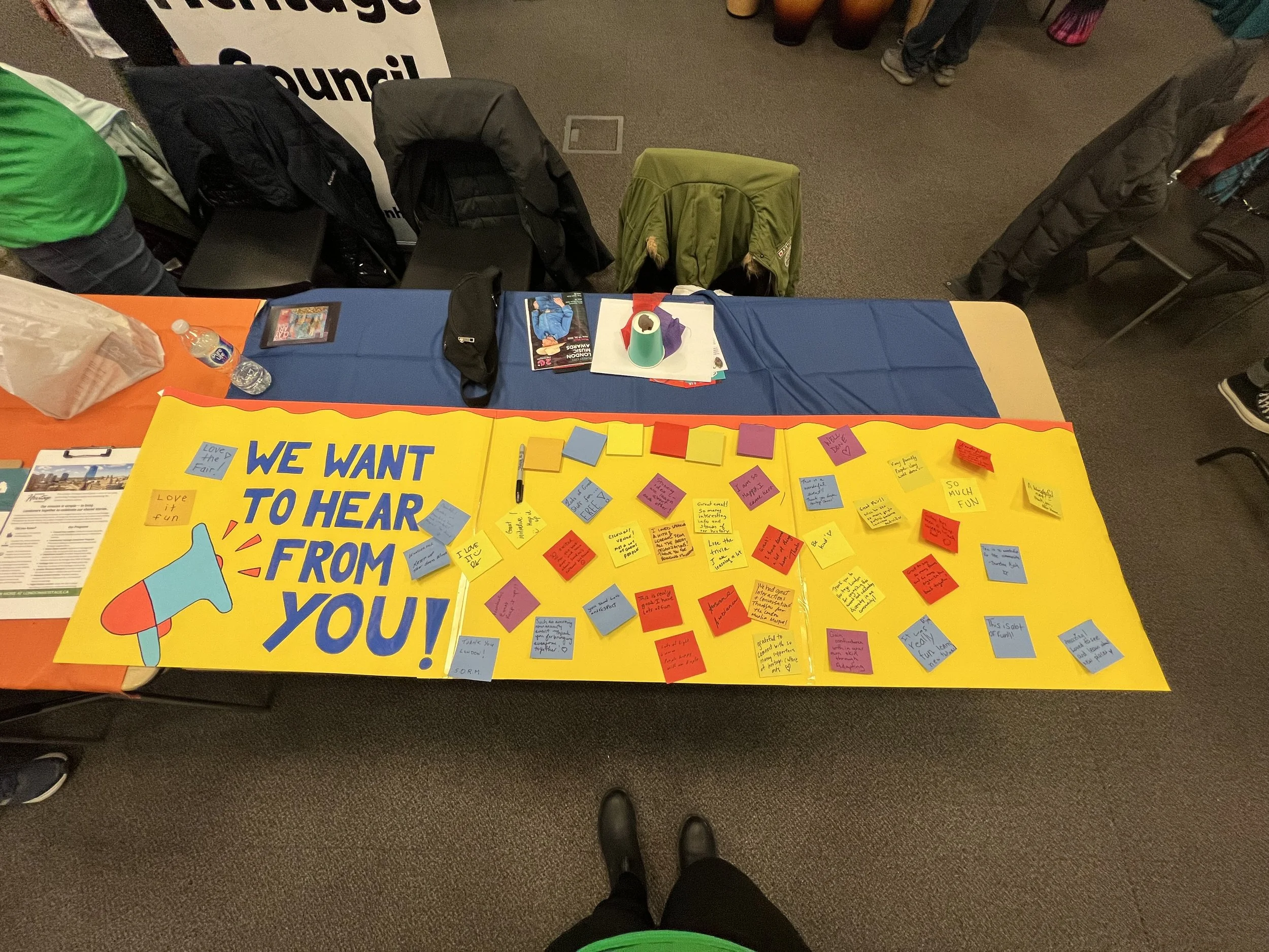 Colourful board with many post-it comments about the Fair