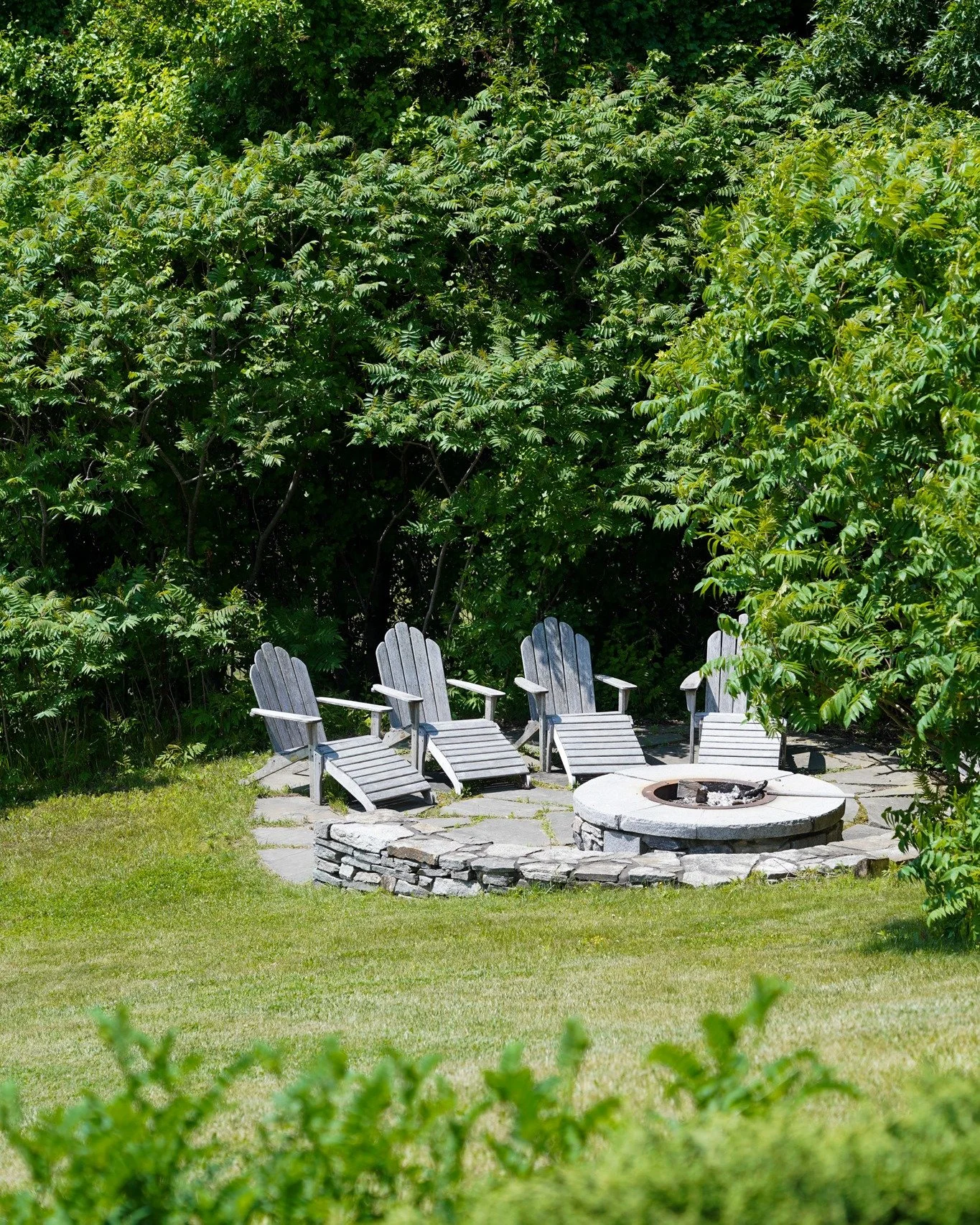 The perfect ending to a day by the sea? A fire, a chair, and good company.