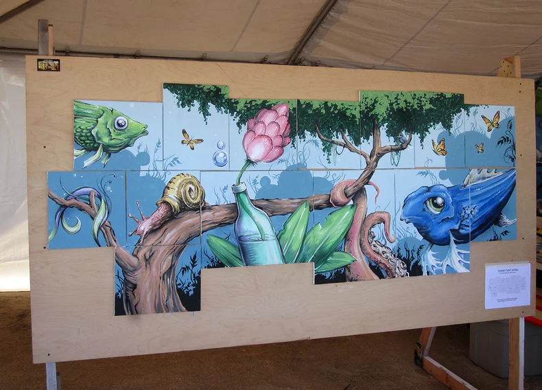 Various canvases painted live during the Tommy Tant Surf Classic / Flagler Beach, FL
