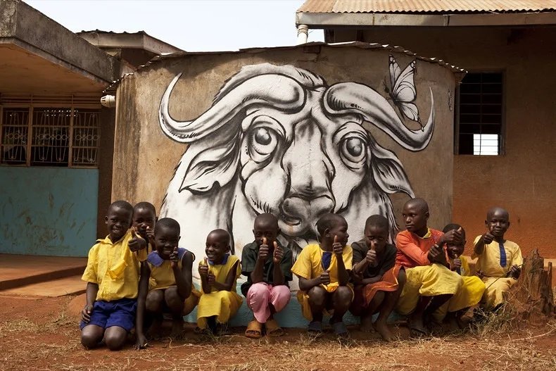 Water Buffalo mural painted for the children at a local primary school in Jinja, Uganda on a water tank.