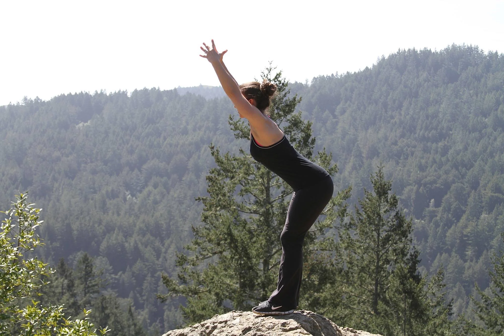 Carrie does a Foundation Training movement in the great outdoors. (Photo Courtesy Carrie Russell)