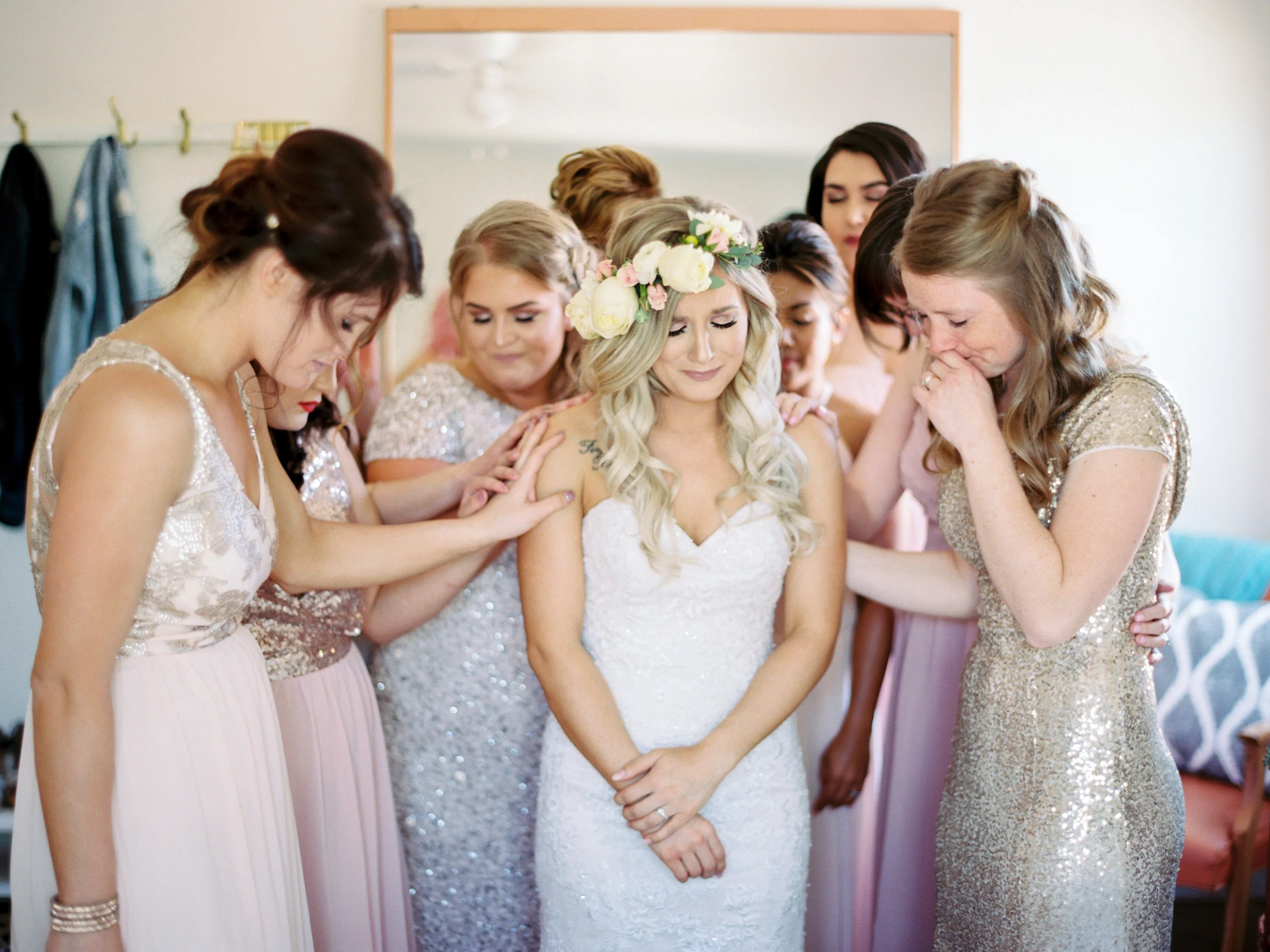A beautiful moment of prayer with my sisters, mom and bridesmaids