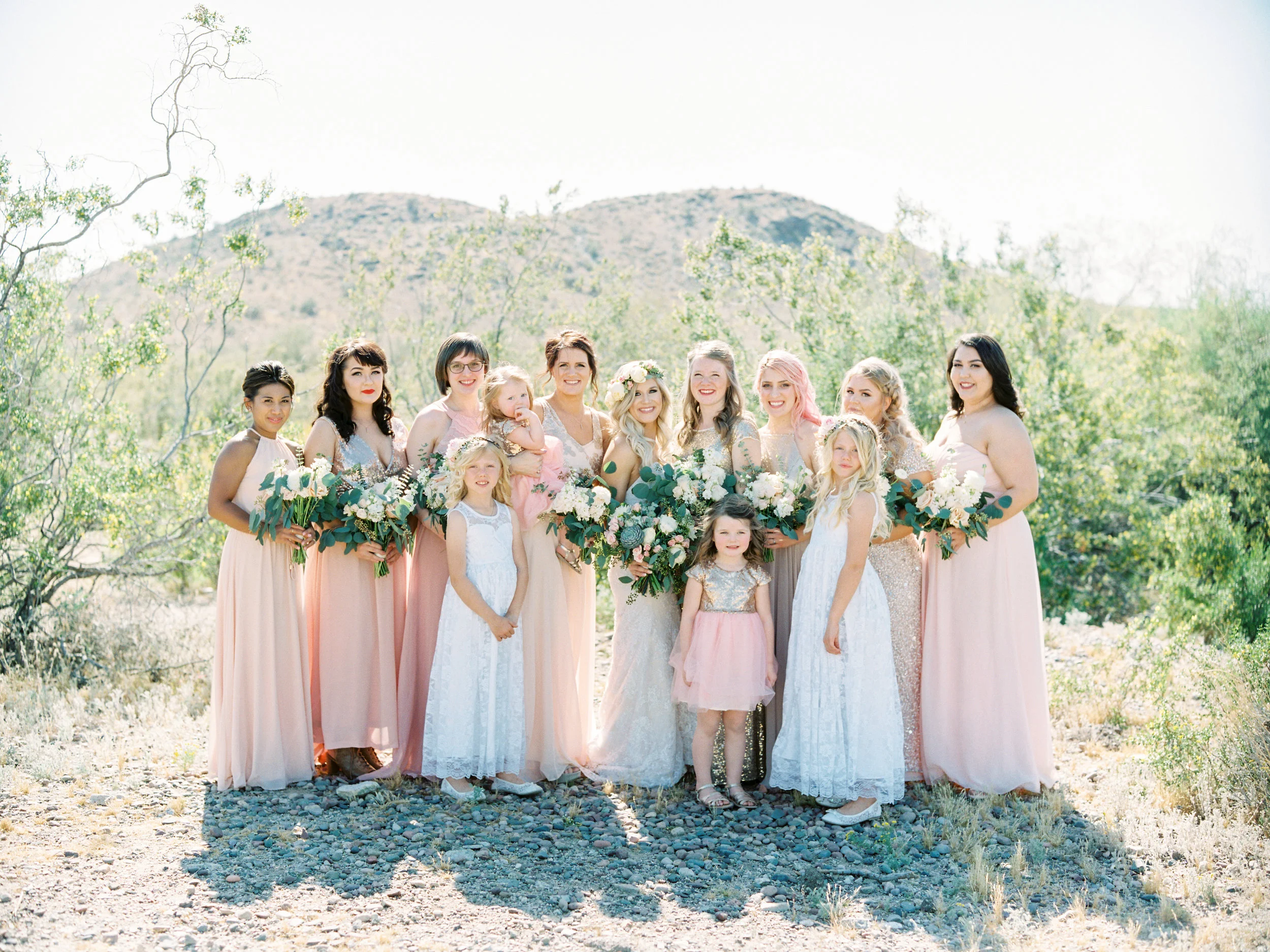 I went with a blush, gold, rose gold & lace color scheme for the females. I found the flower girl and miniature bride dresses on Etsy. I let my bridesmaids pick out their dresses and we coordinated so well!