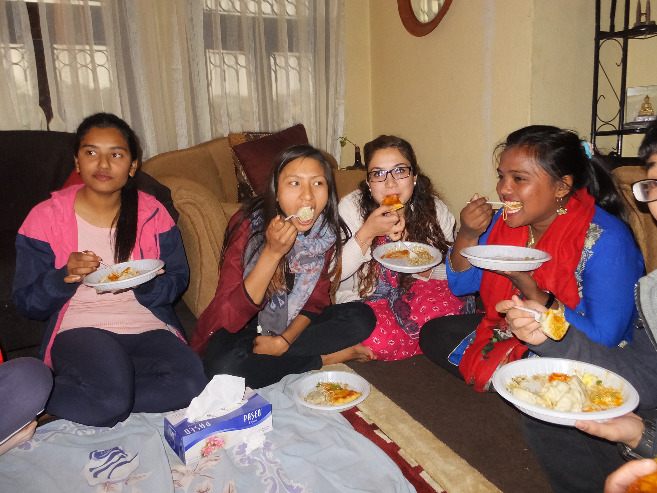 Older girls enjoying a good meal in their hostel.