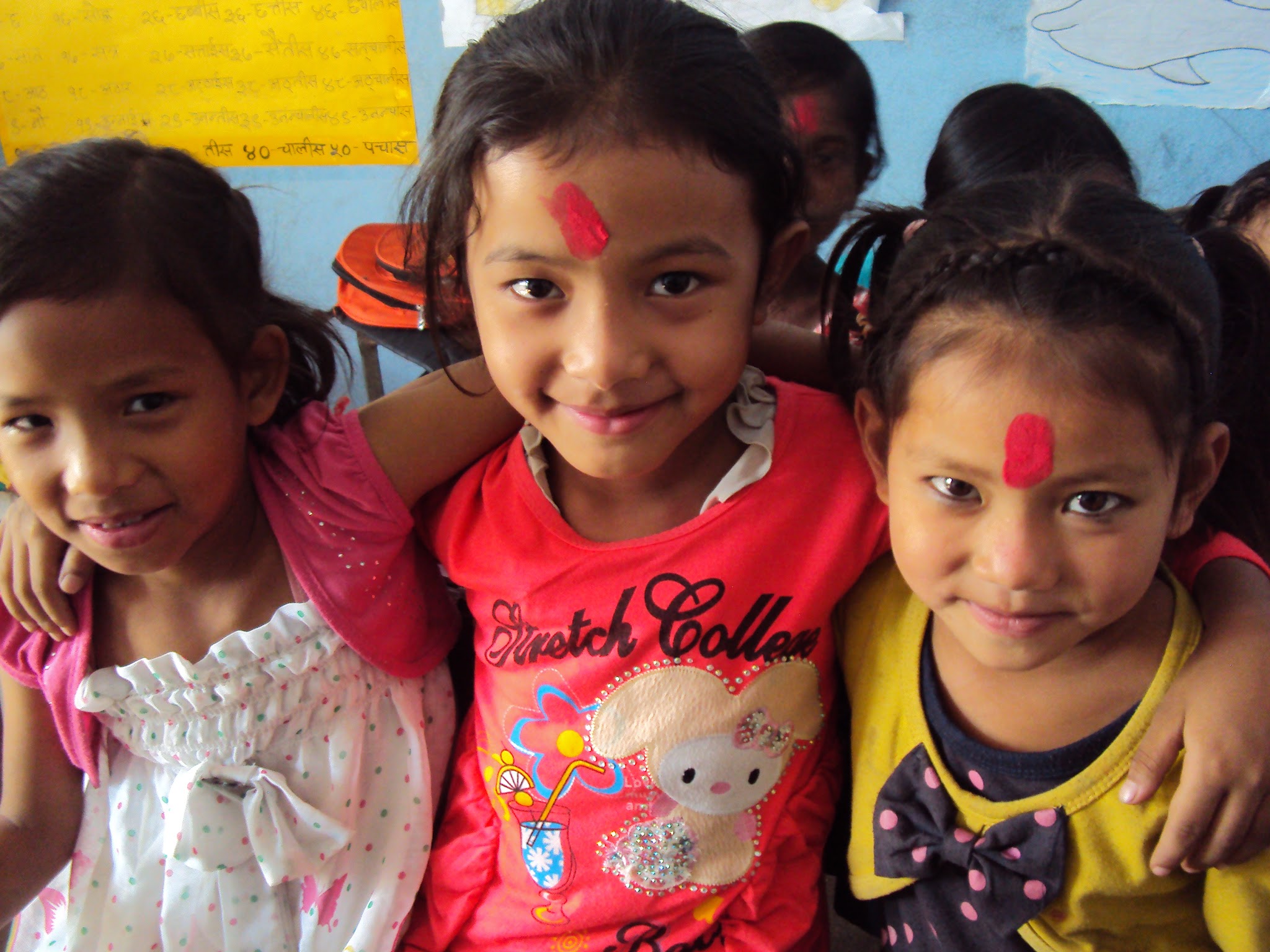 Old friends- girls play at the Contact Center.