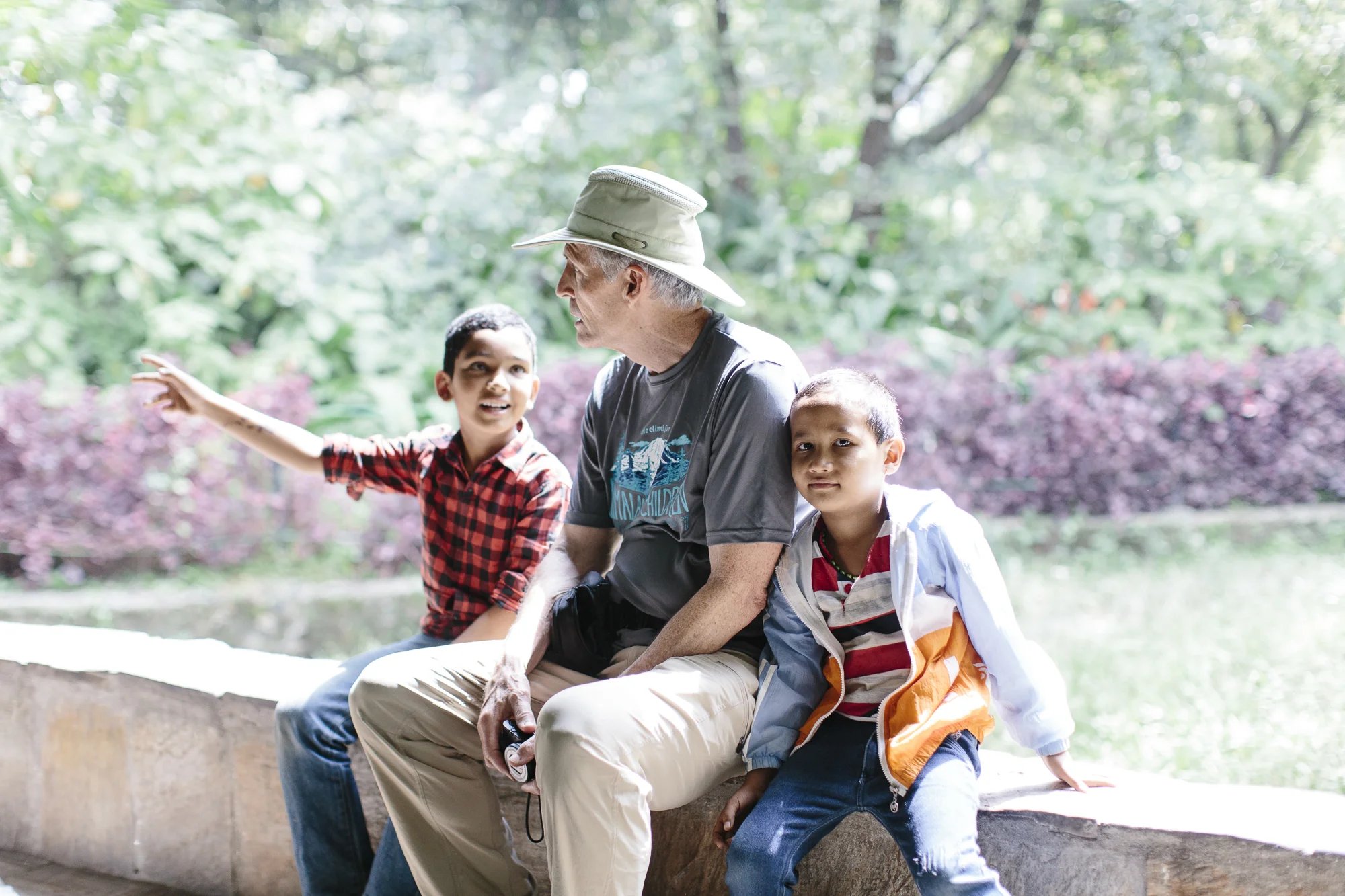 Rick and kids take a break and watch the animals at the Zoo