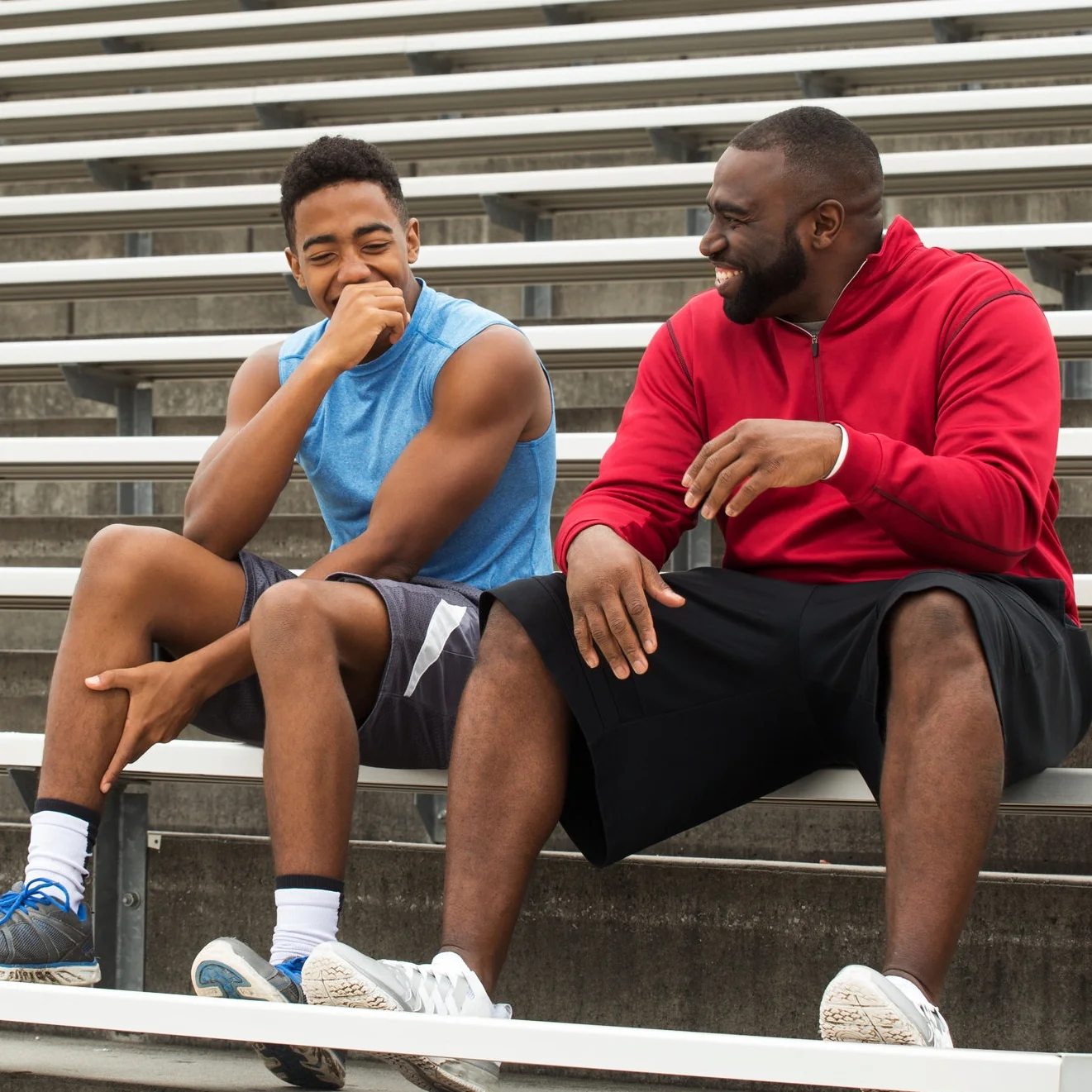 Teen and Coach on Bleachers.jpeg