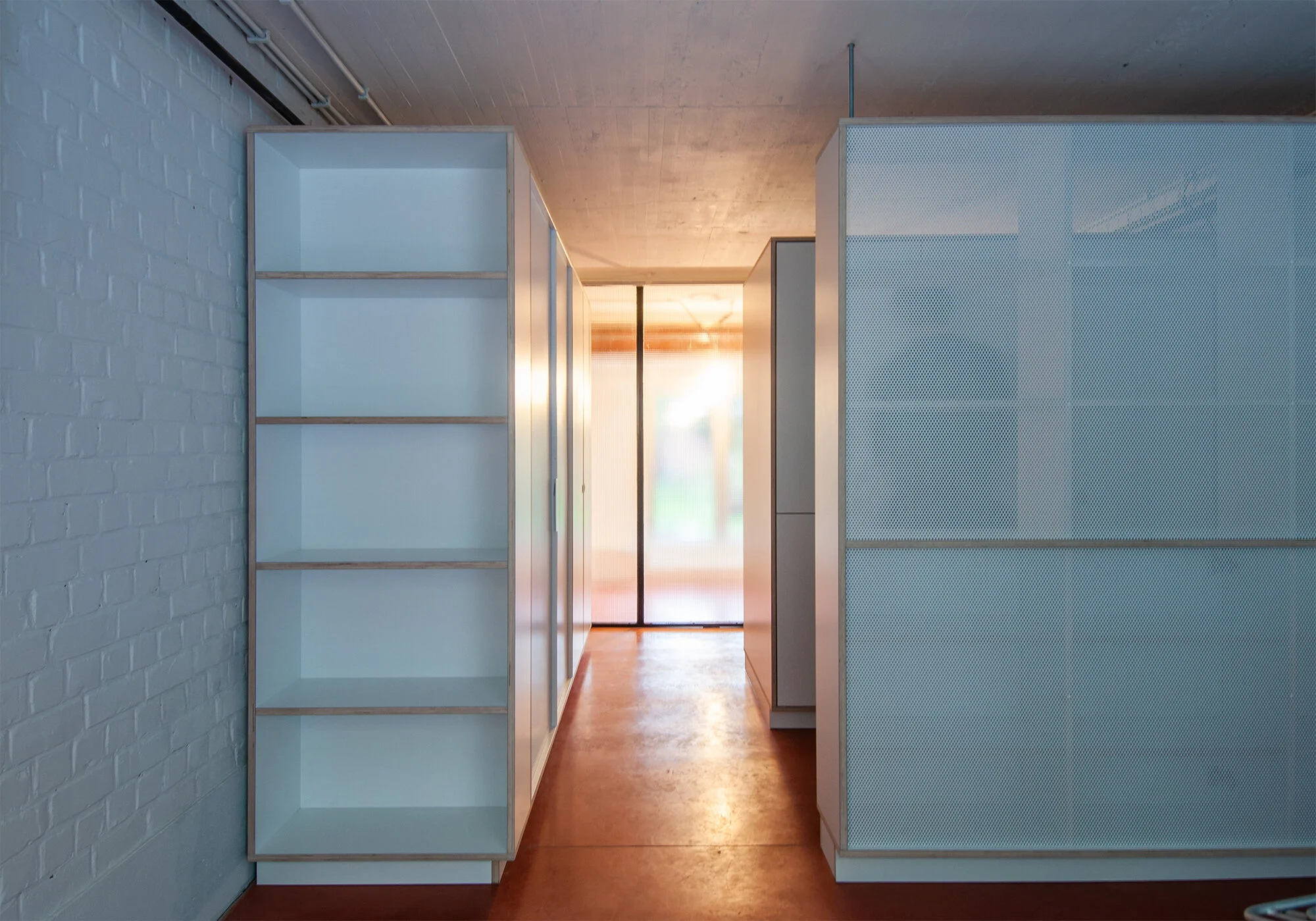 transformation of a bel-etage to a library and storage space