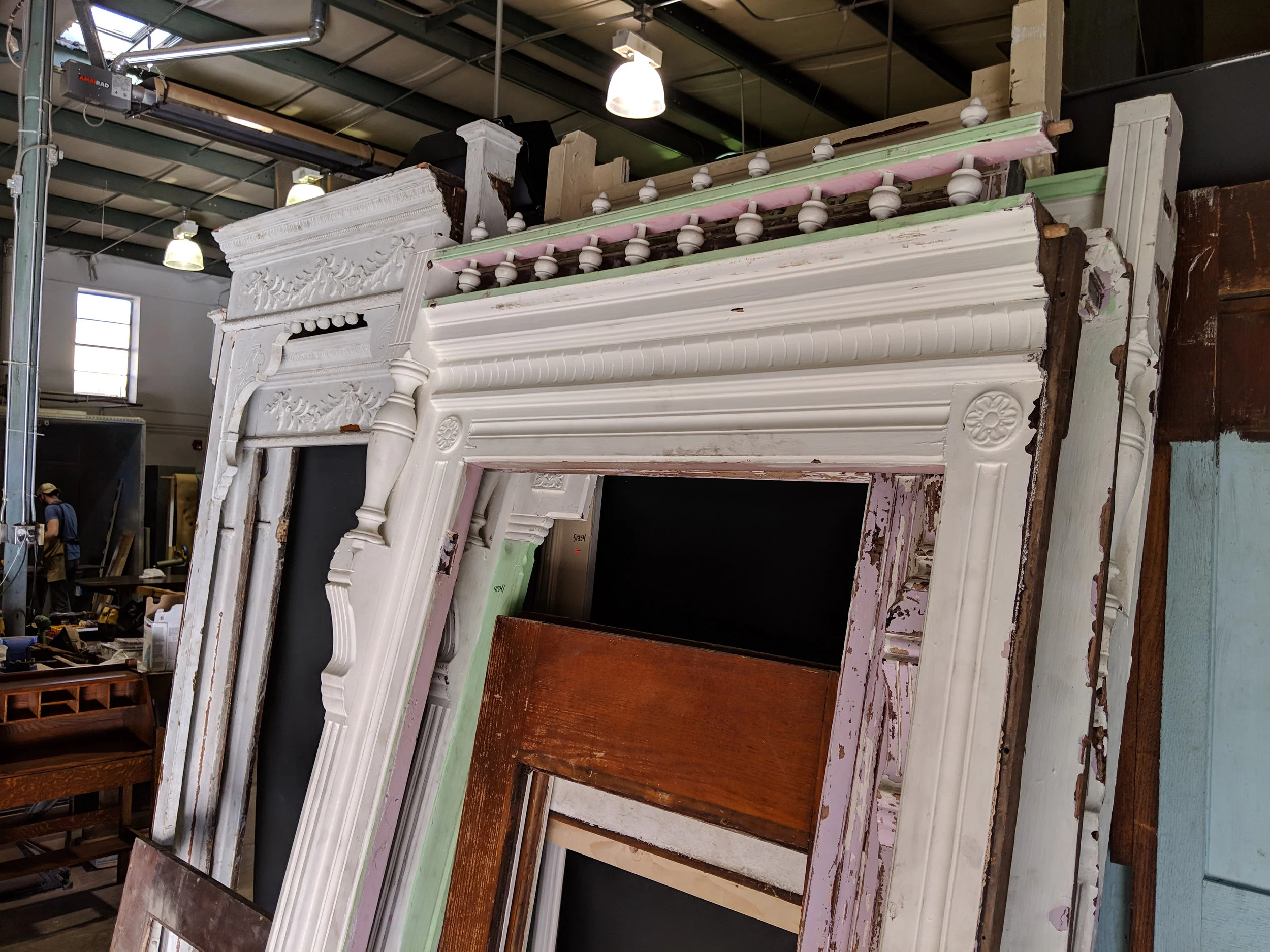 As you can see, these closet faces were covered in a variety of different paint colors before we got our hands on them.