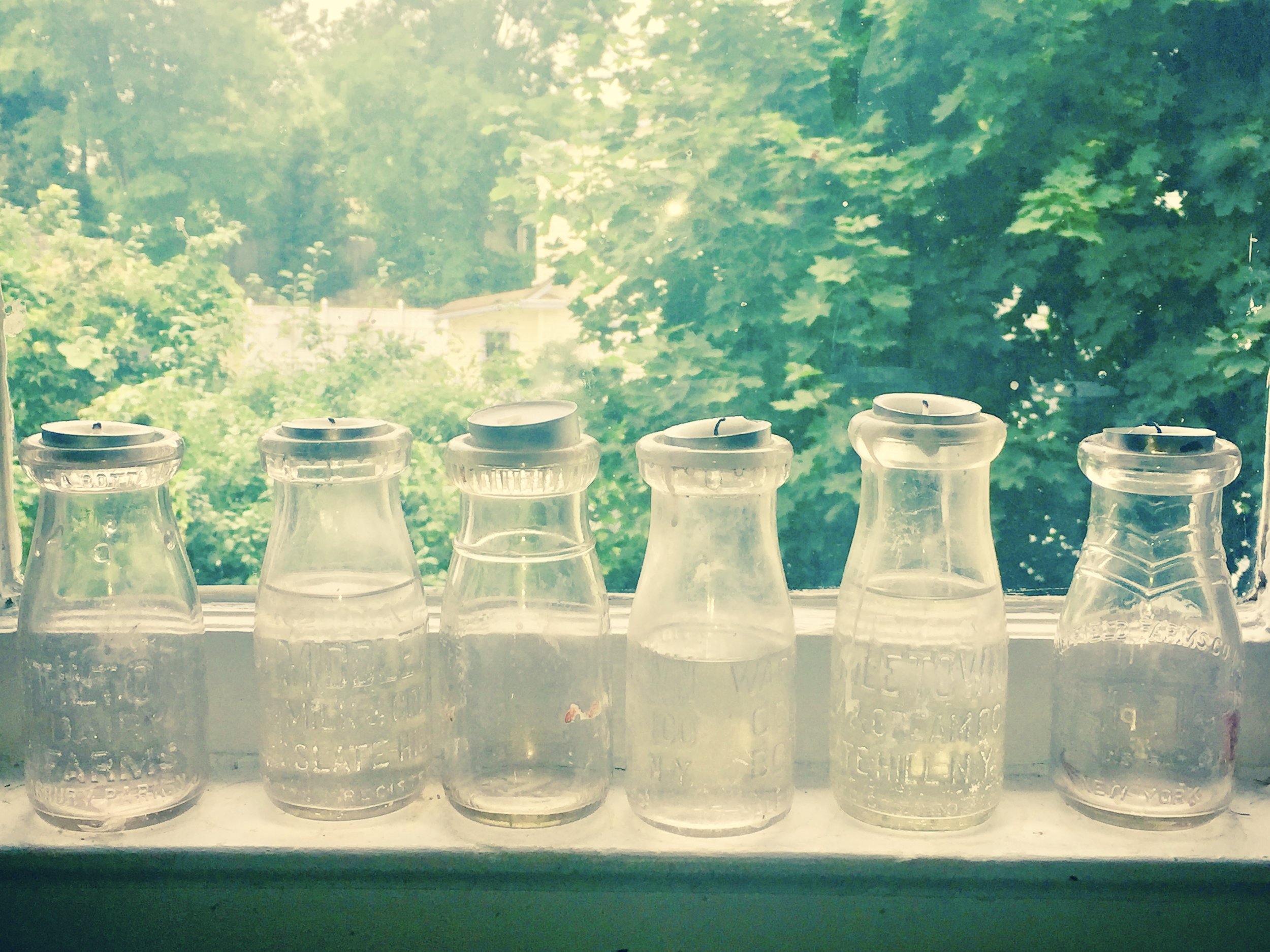 Milk bottle candle holders