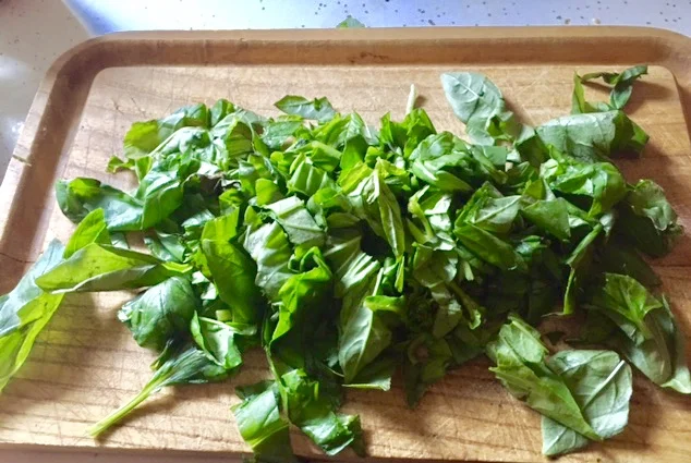 Plan of Attack Make the Pesto: Chop the Basil leaves. Add them, as well as third cup of garlic, 0.25 cup of olive oil, parmesan cheese, salt and pepper (to taste) to a food processor