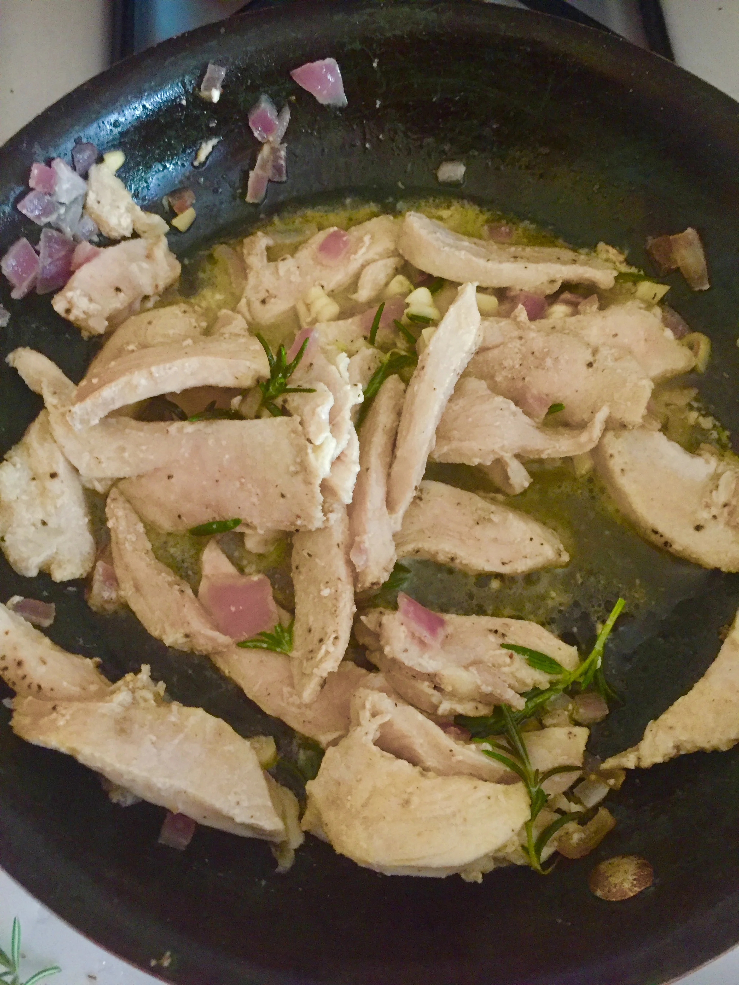 Ingredients 3 sprigs of Rosemary diced sm red onion 2-5 cloves of garlic (diced) .chicken breast 0.25 stick of salted butter 2 portions of penne Salt and Pepper (to Taste) powdered garlic Plan of attack Cut the chicken breast into strips Add tbls of butter to the skillet and on medium heat add onions and garlic. Saute until both onions and garlic are clear. Add the chicken breast strips to the skillet and turn on medium heat, stirring frequently. Season with salt, pepper and powdered garlic. In a medium saucepan boil salted water and add penne when the water becomes a rolling boil. Add the remaining butter to the skillet and place lid on the skillet so a sauce begins to develop. Remove penne from heat when penne is al dente. Drain pasta and put aside. When chicken is cooked through, add the chicken mixture to the penne and serve hot.