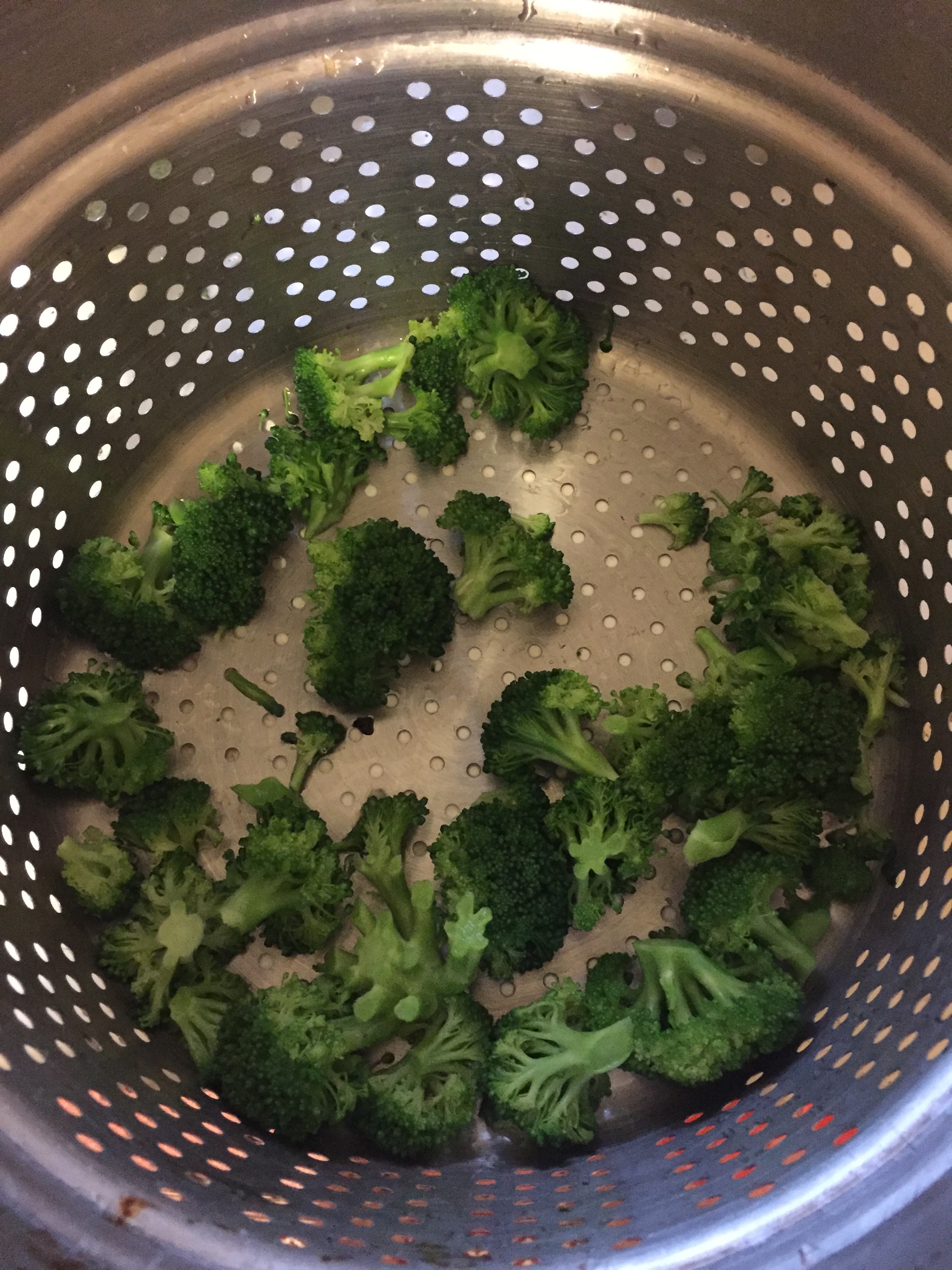 While bacon, onions and garlic are cooking, cut the broccoli into bite sized pieces, and add them to a medium saucepan with salted boiling water. Cook broccoli in sauce pan for two minutes and then strain the broccoli using your colander. Add the br…