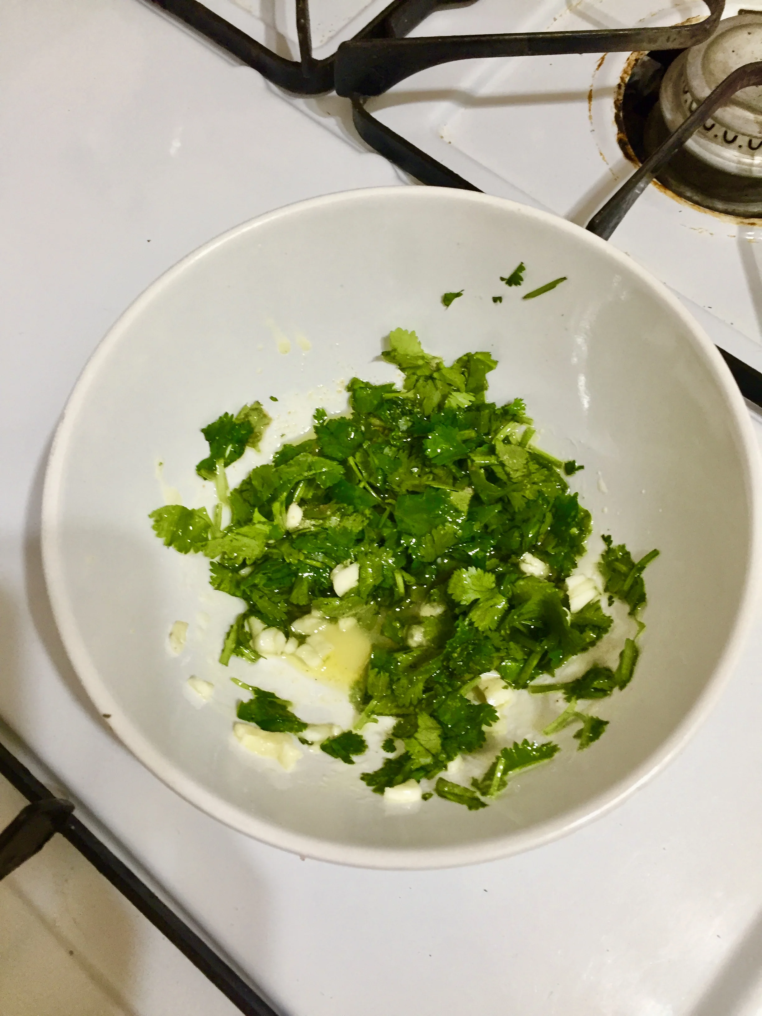 Coat the salmon steaks with cilantro and garlic mixture generously.