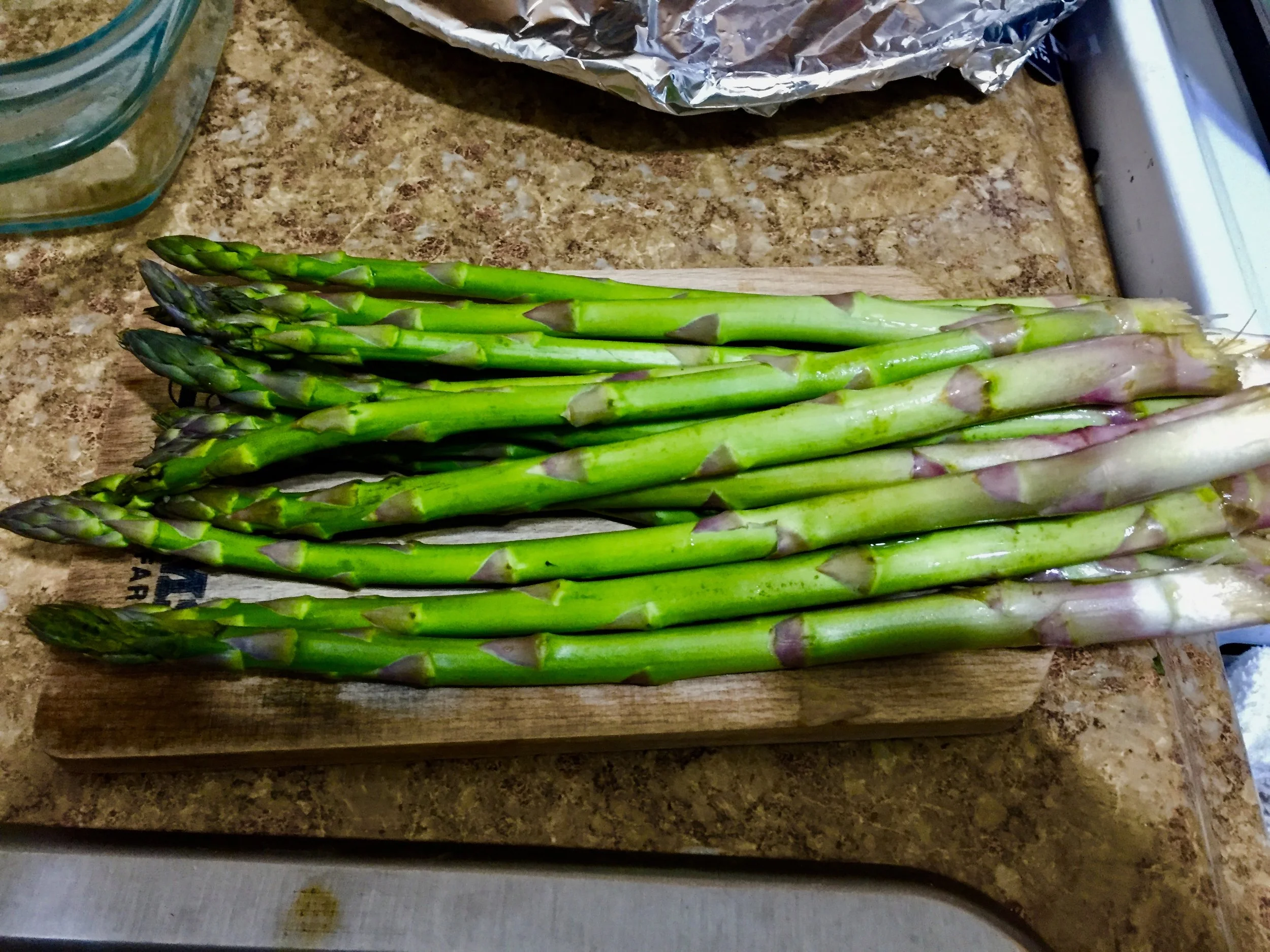 Trim Asparagus and cut each stalk into thirds. When the orzo has cooked for 9 minutes, add the asparagus, 0.25 cup of grated parmesean, and lemon juice. Mix throughly
